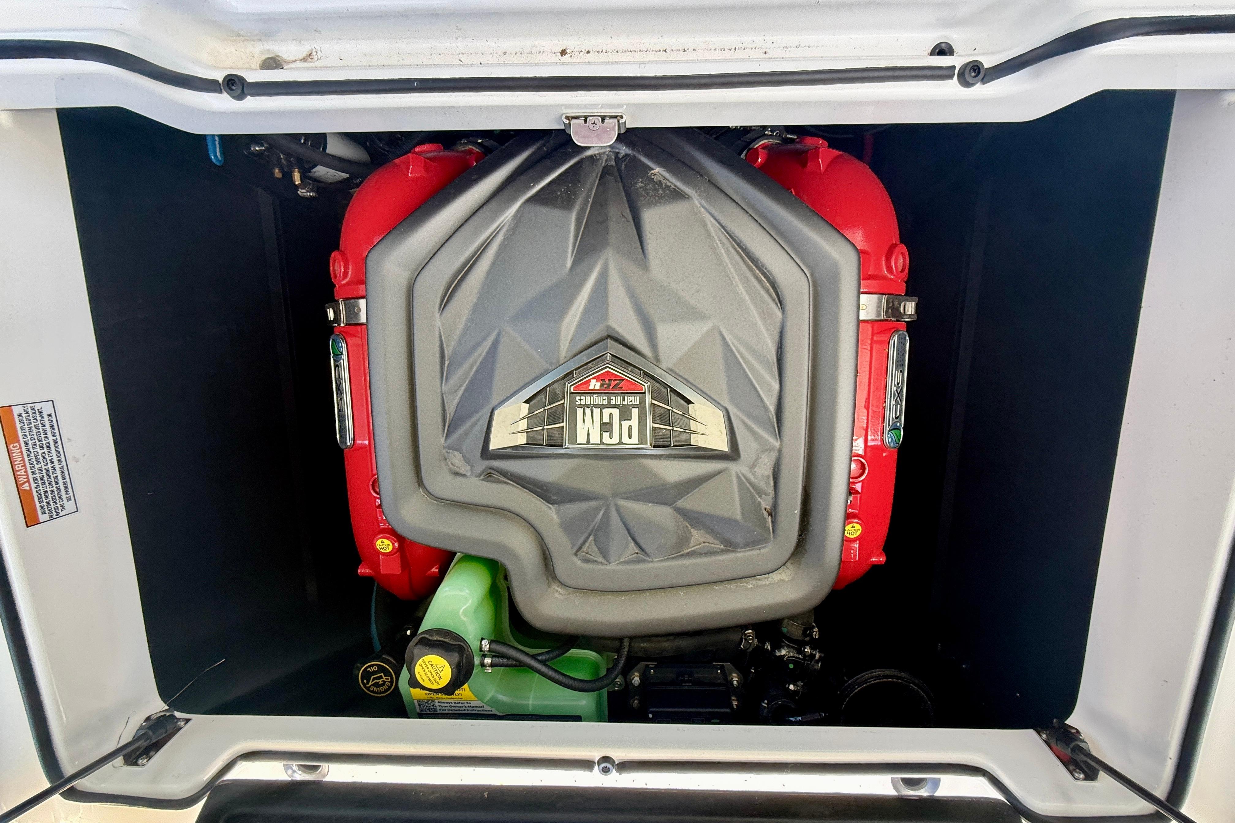 2024 Nautique Super Air Nautique GS20 engine compartment with PCM engine visible.