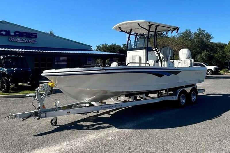 2026 Ranger 2360 Bay boat on trailer, parked outside dealership.