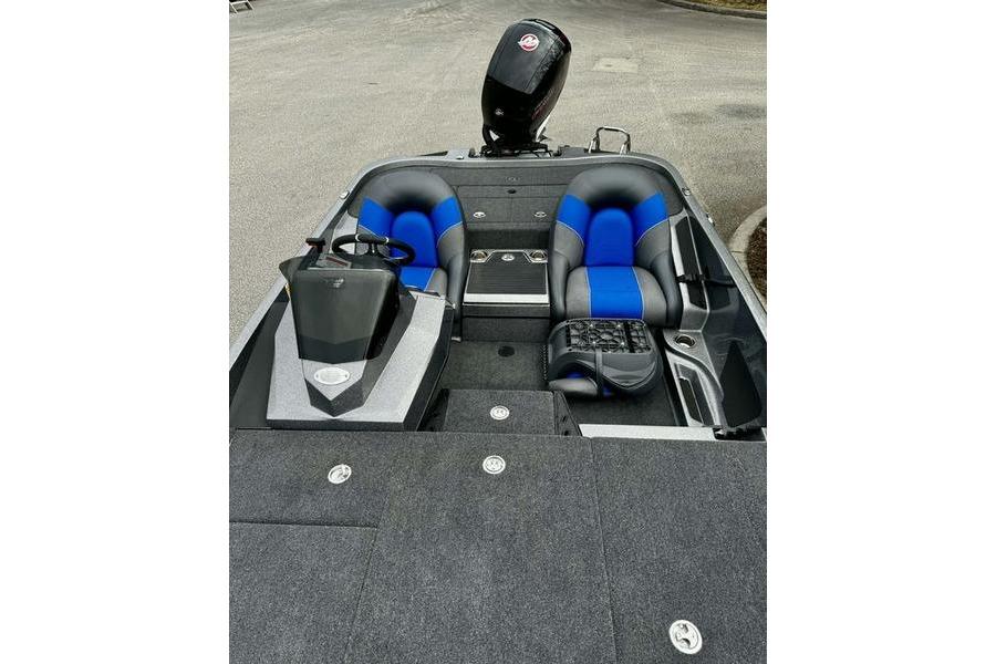 2026 Ranger Z185 boat interior with blue and black seats, steering console, and motor.