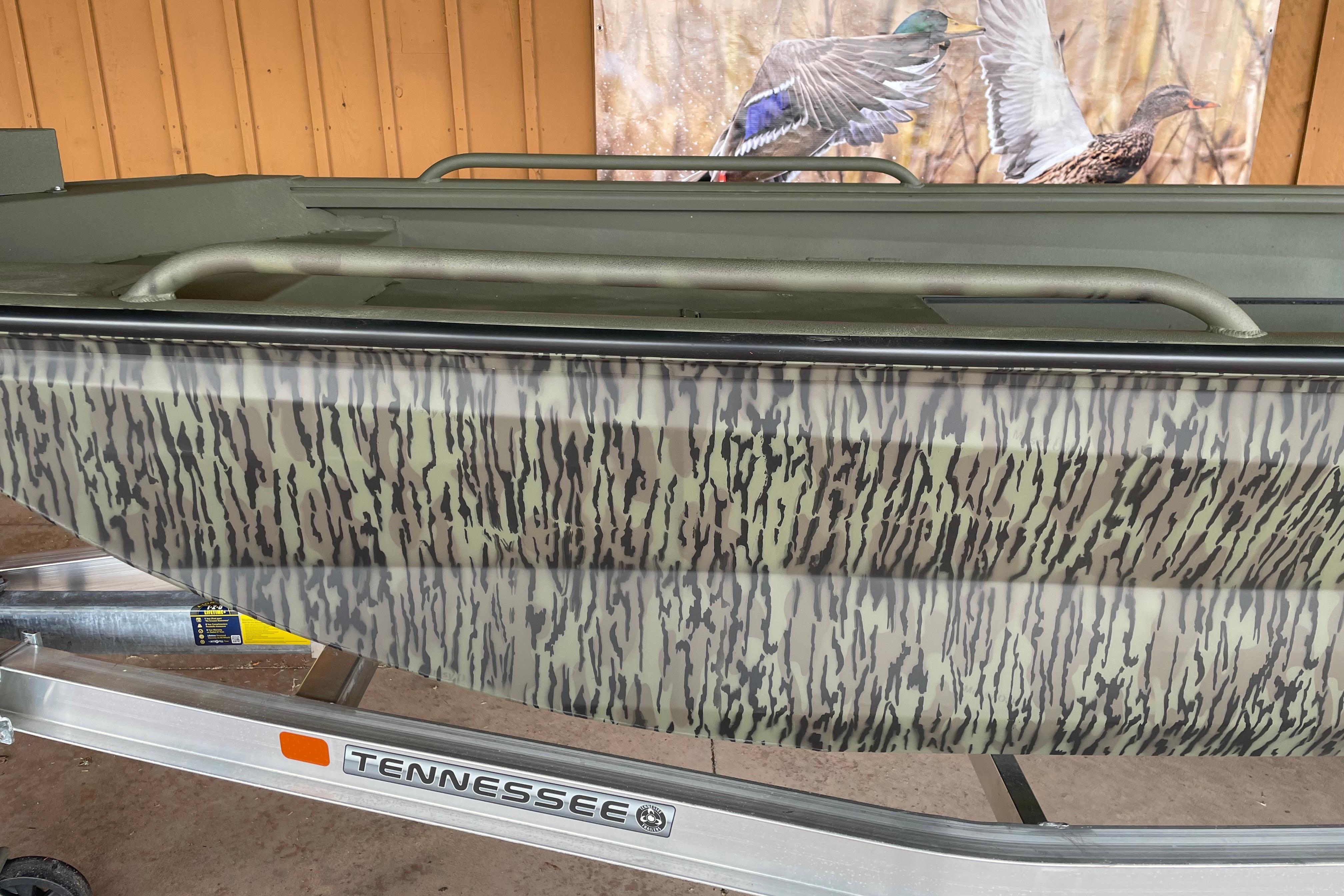 2026 Reaper Boats 753 Timber Reaper with camouflage design on Tennessee trailer.