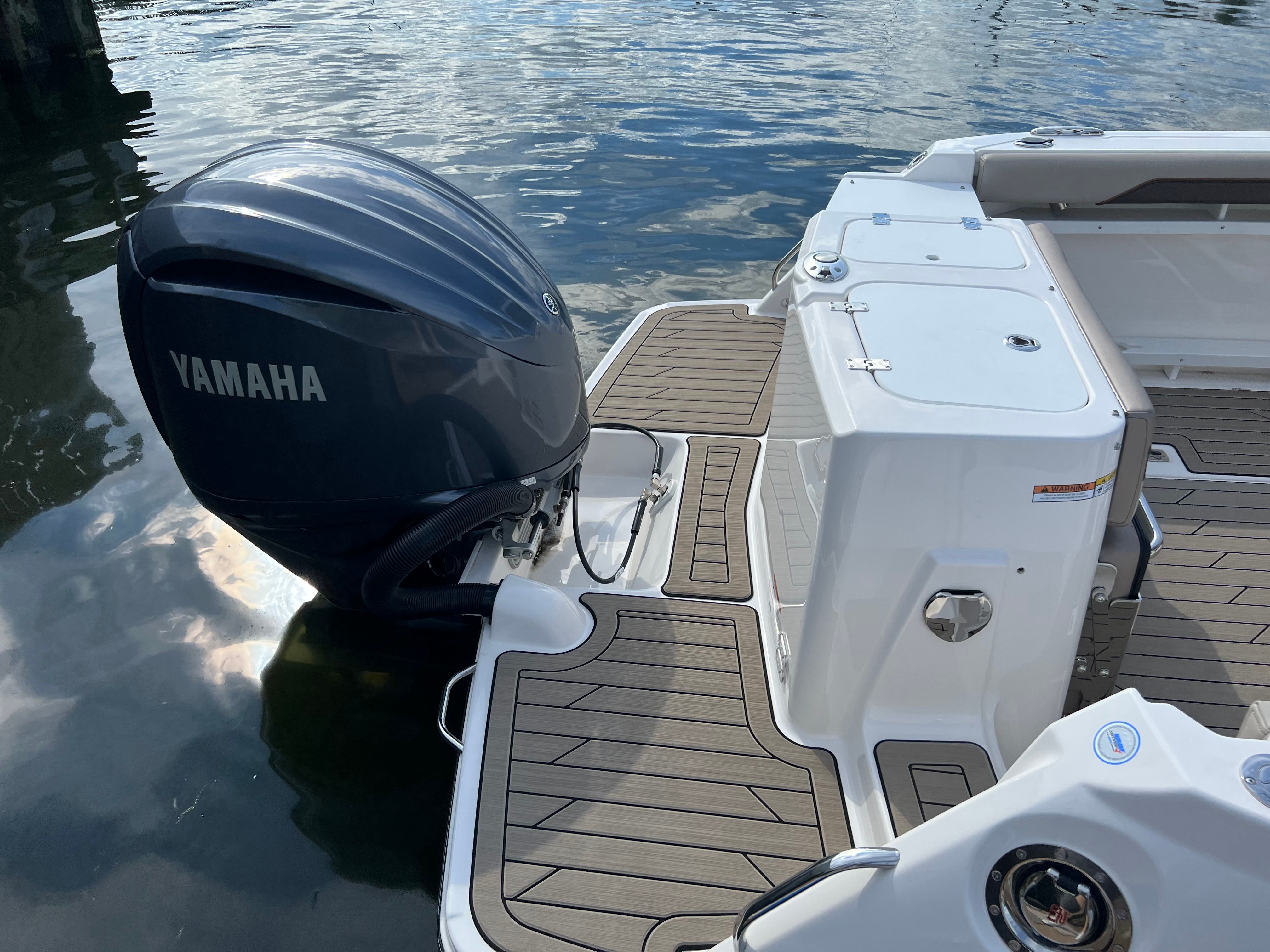 The image shows the stern of a 2022 Cutwater C-24 CW boat with a Yamaha outboard motor.