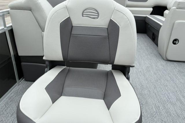 2026 Sun Tracker Fishin' Barge 22 DLX boat seat, gray and white upholstery.