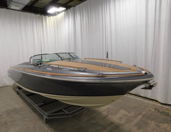 2021 Chris-Craft Corsair 34 boat in a showroom.