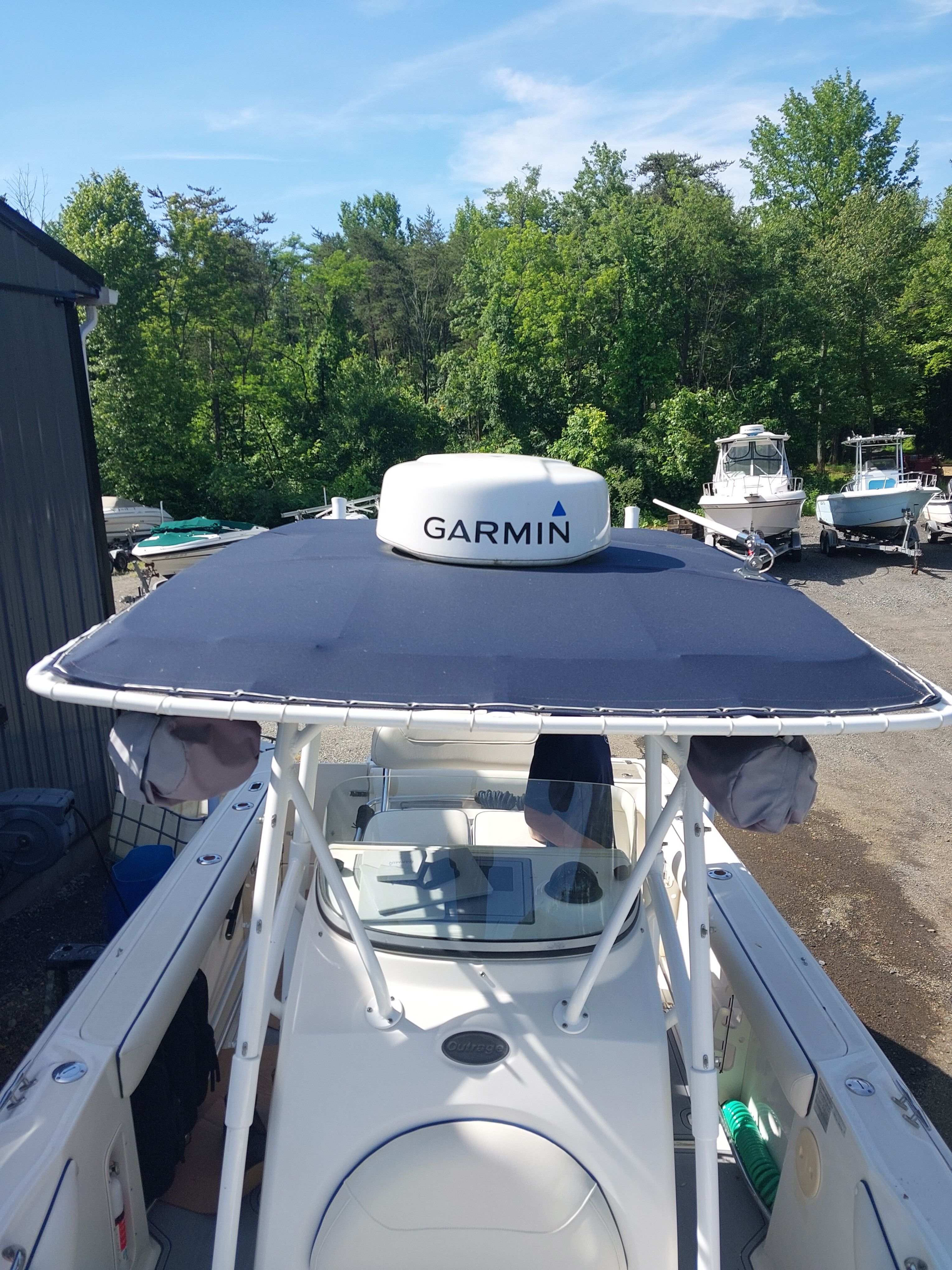 A 2005 Boston Whaler 240 Outrage with a Garmin radar on the roof.