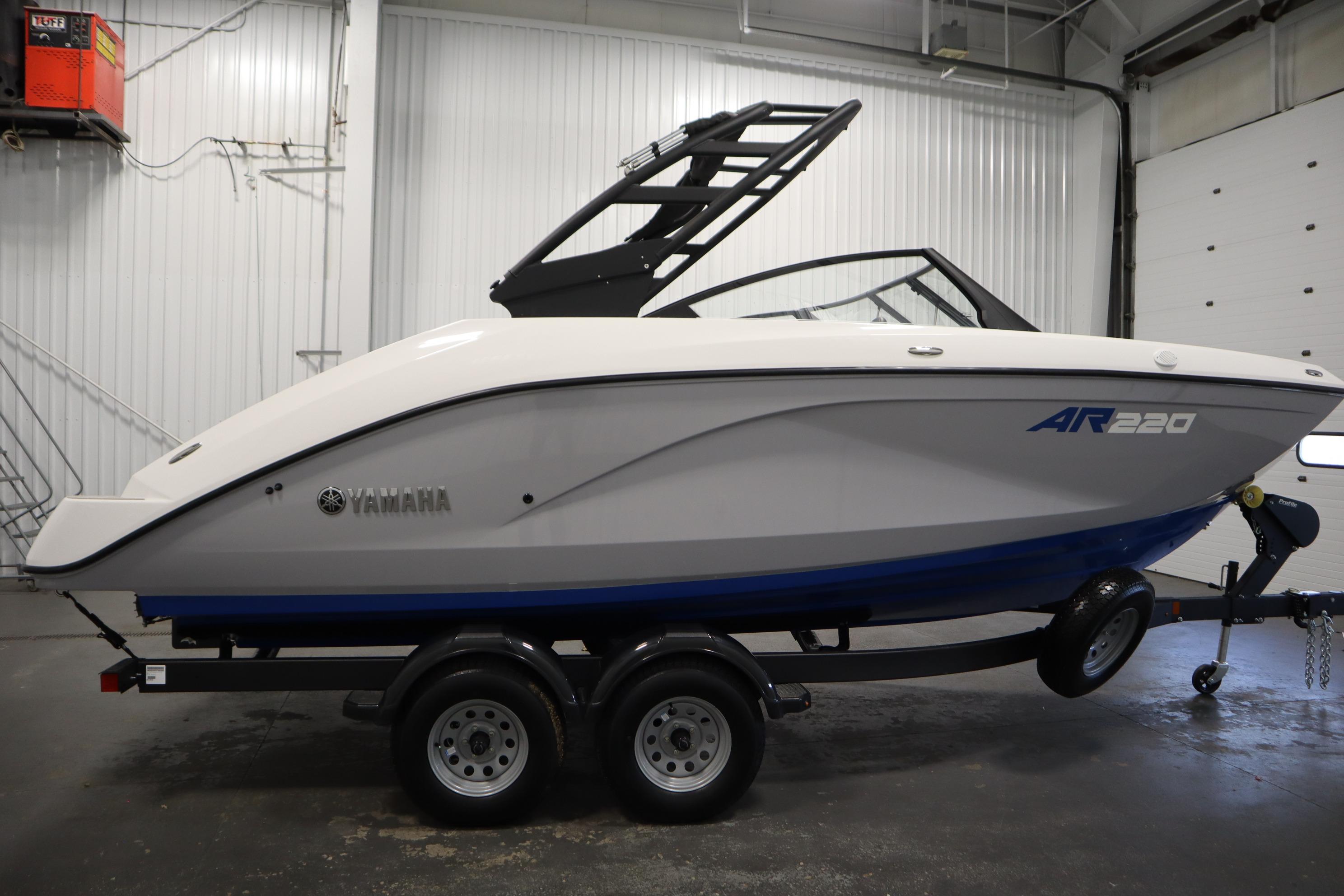 2026 Yamaha Boats AR220 on trailer in indoor showroom.