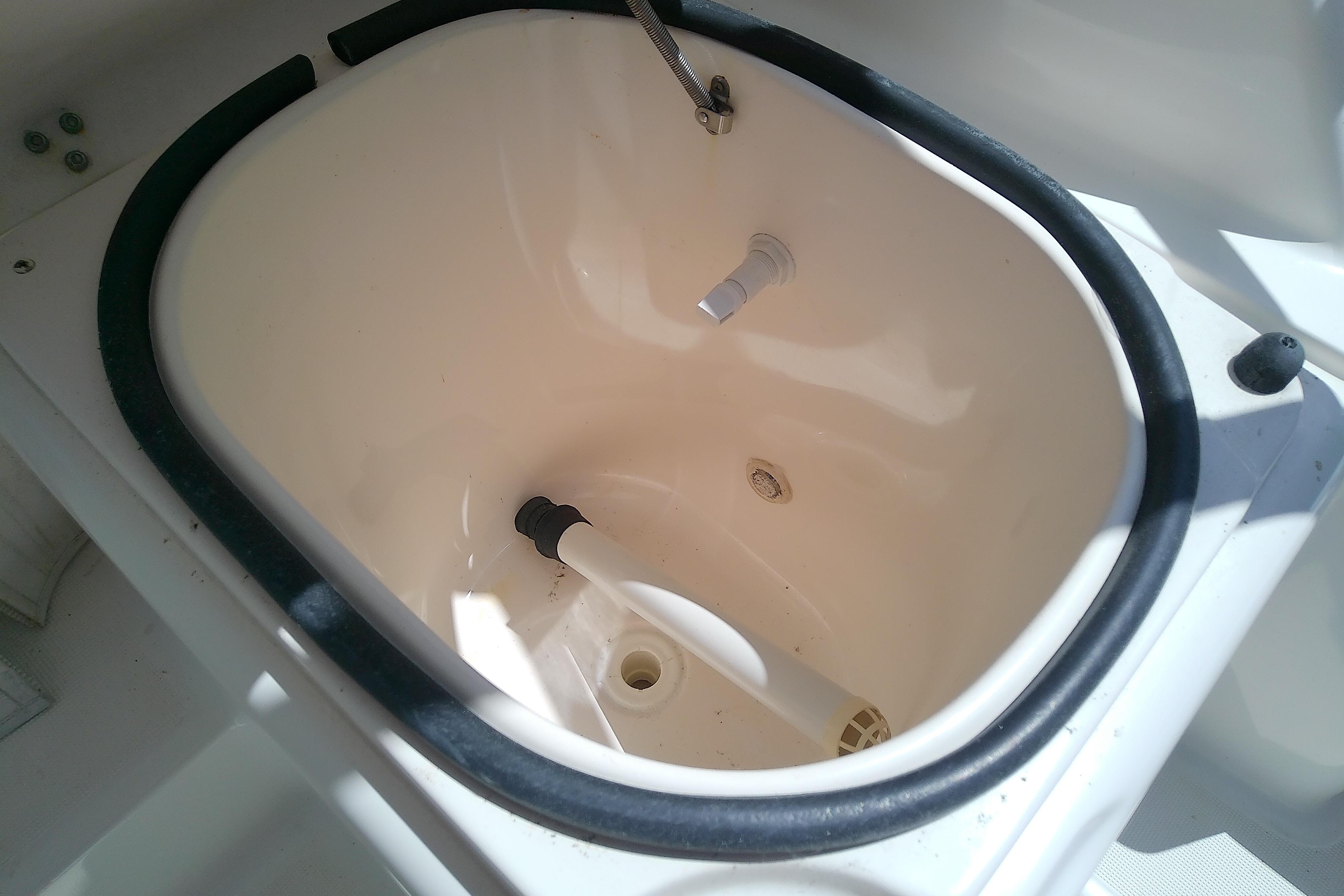 Livewell on a 2000 Tiara Yachts 4100 Open boat, featuring a white interior.
