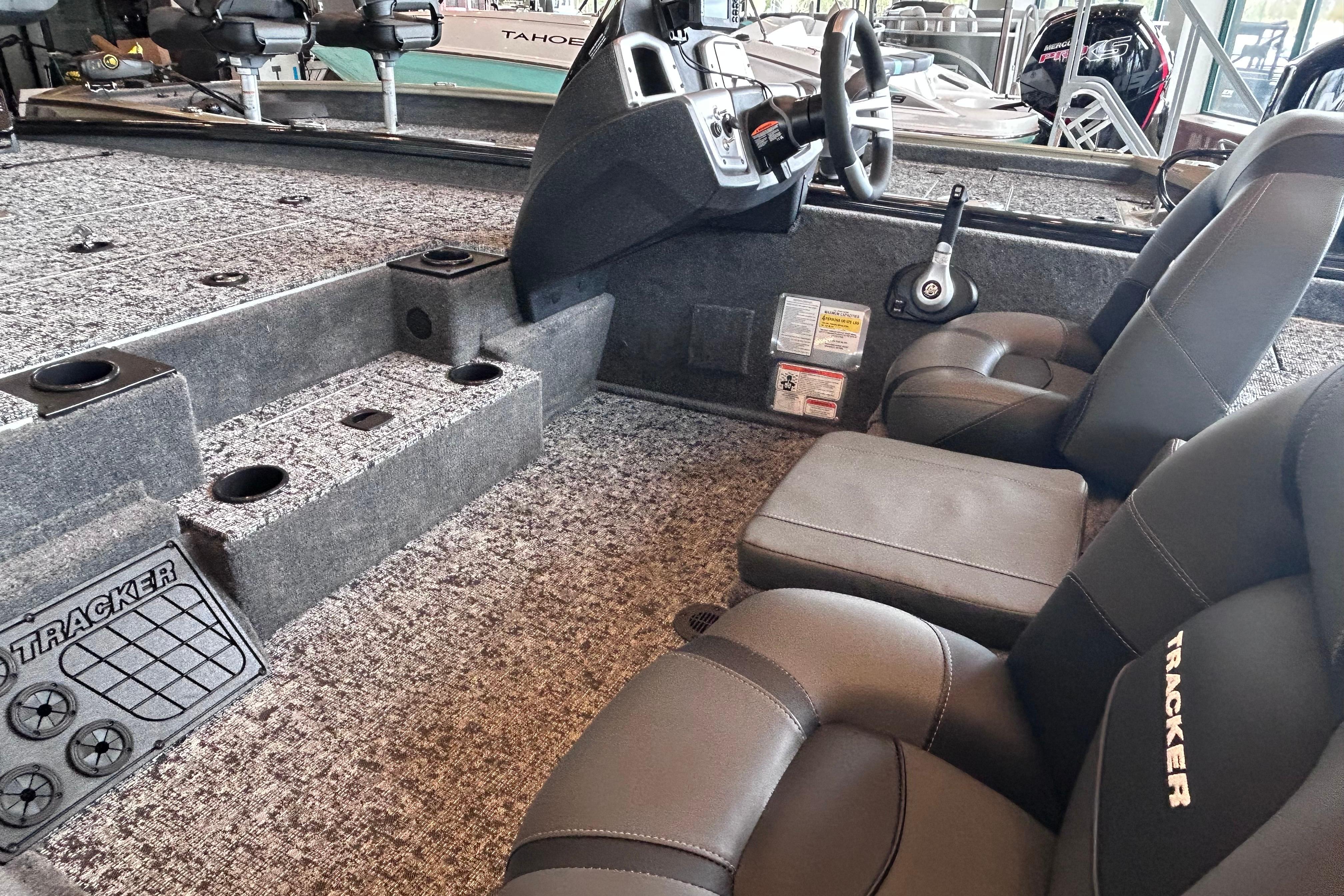 Interior of 2026 Tracker Pro Team 195 boat with seating and steering console.