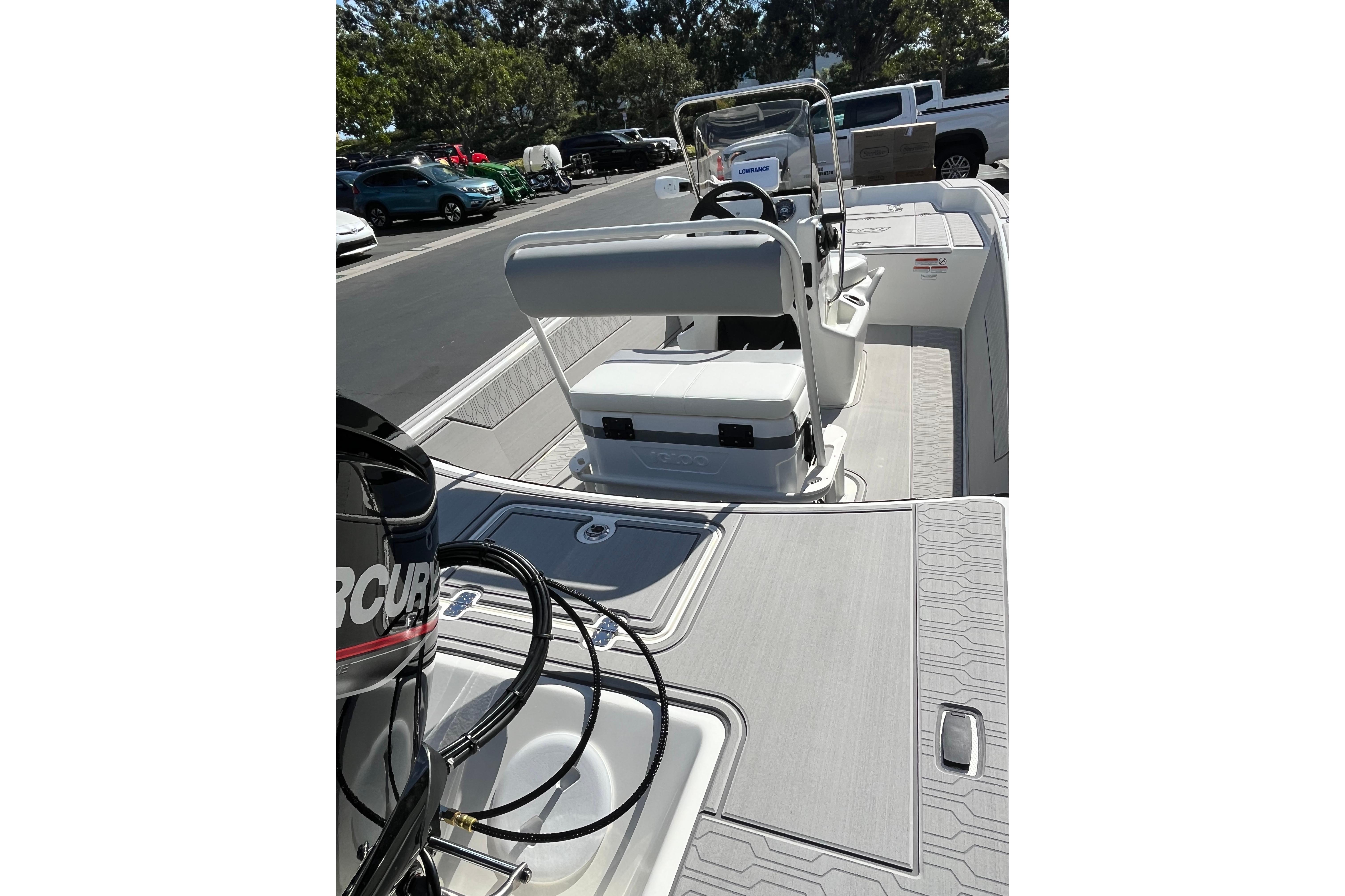 2026 Mako Pro Skiff 17 CC boat interior with seating and control console.