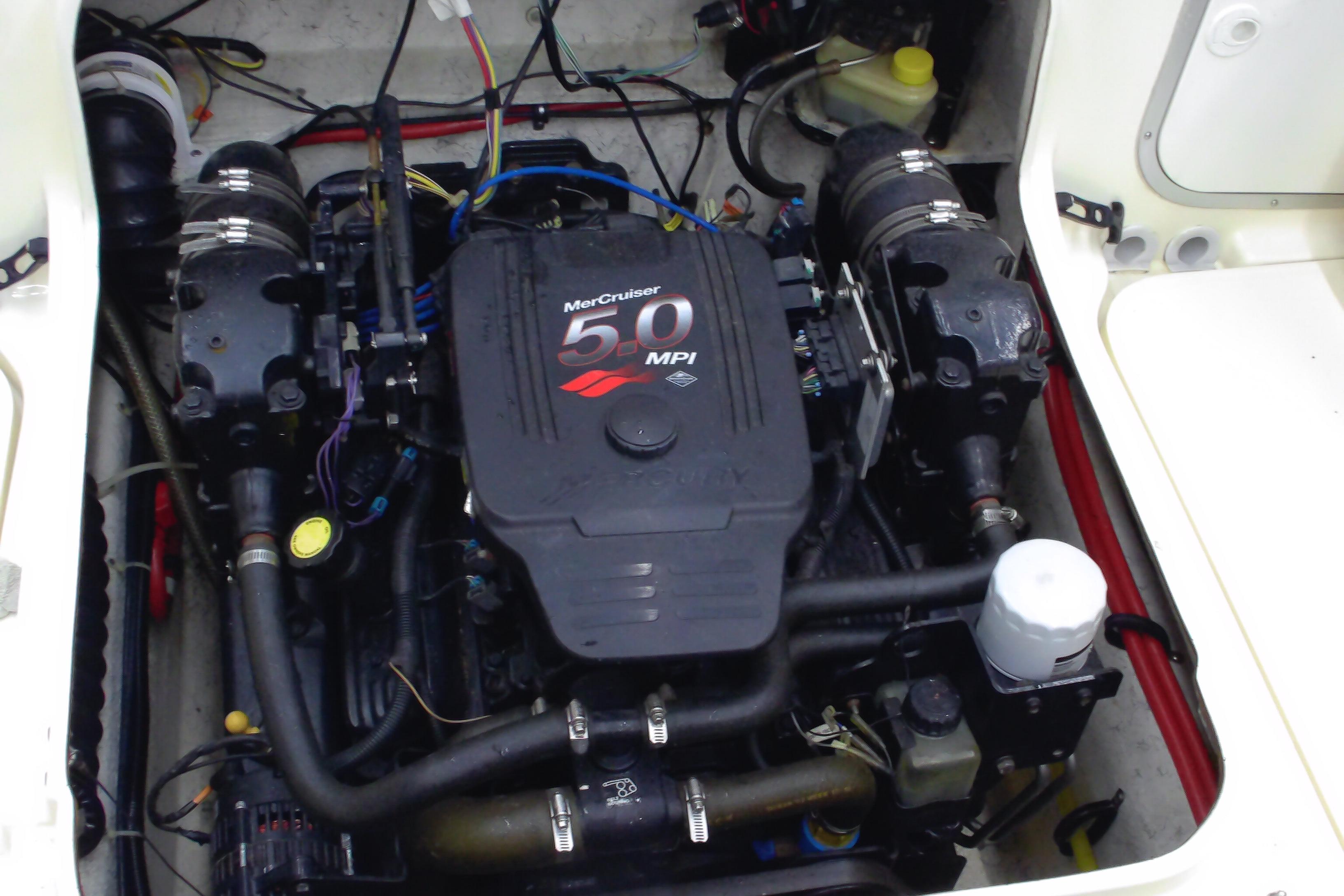 Engine compartment of a 2004 Trophy 2352 Walkaround with MerCruiser 5.0 MPI engine.