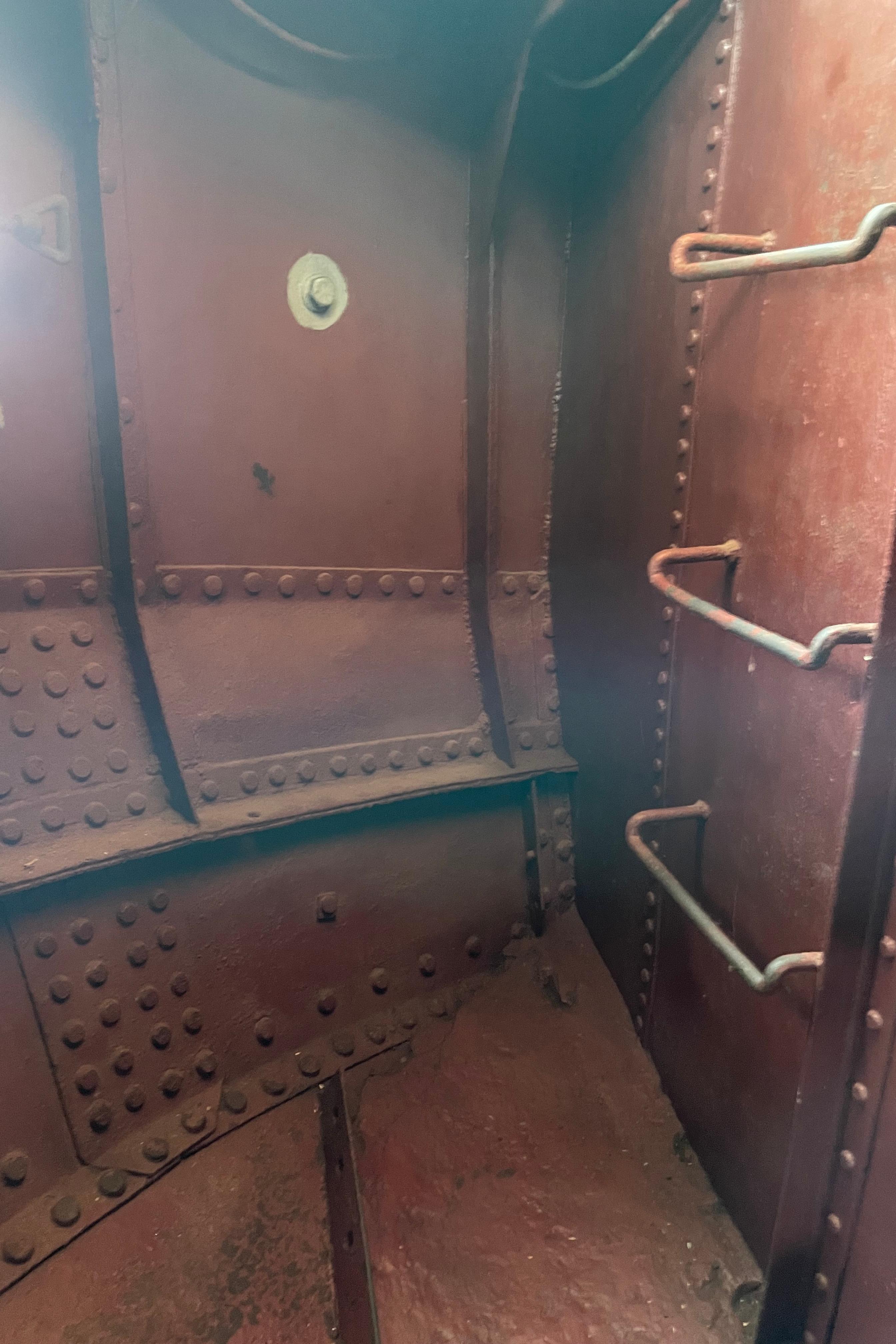 Interior of a 1930 Custom Gronigen, showcasing riveted metal and ladder details.