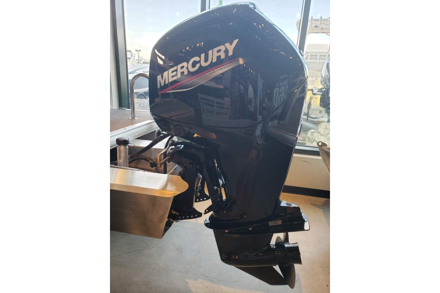 Mercury outboard motor on 2026 Sun Tracker Fishin' Barge 20 DLX boat.