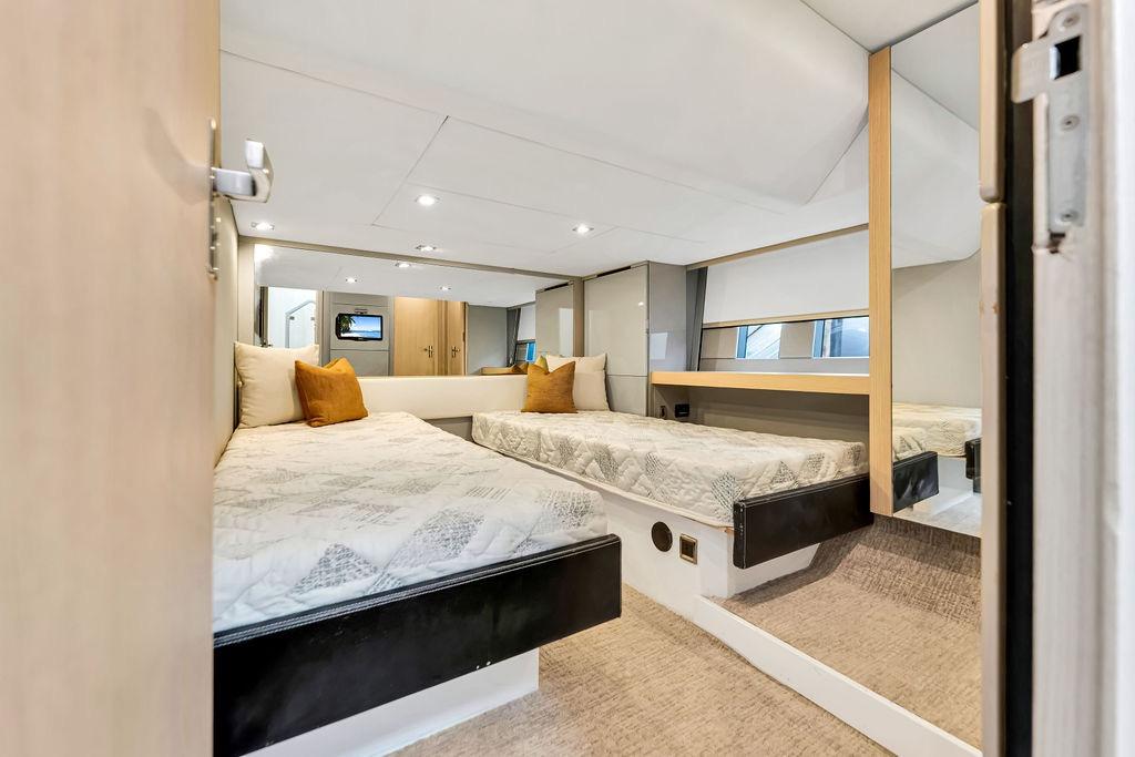 Interior of 2012 Fairline Targa 58 yacht with twin beds and modern decor.