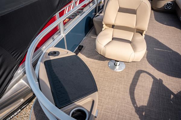 2025 Sun Tracker BASS BUGGY 18 interior with beige seating and fishing station.
