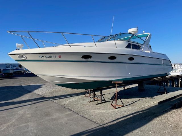 A 1989 Tiara Yachts Slickcraft is on a dry dock.