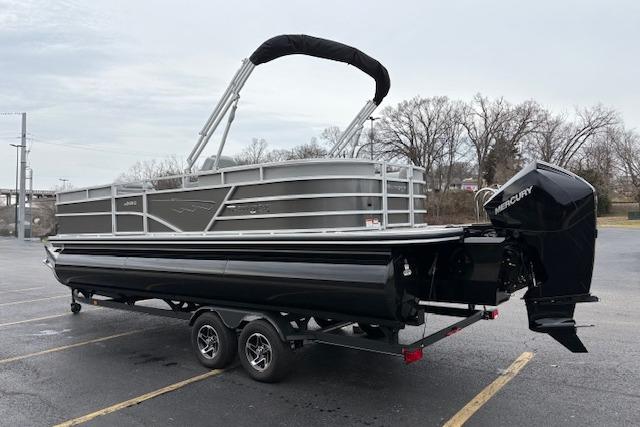 2025 Ranger Reata 243C pontoon boat with Mercury outboard engine on trailer.