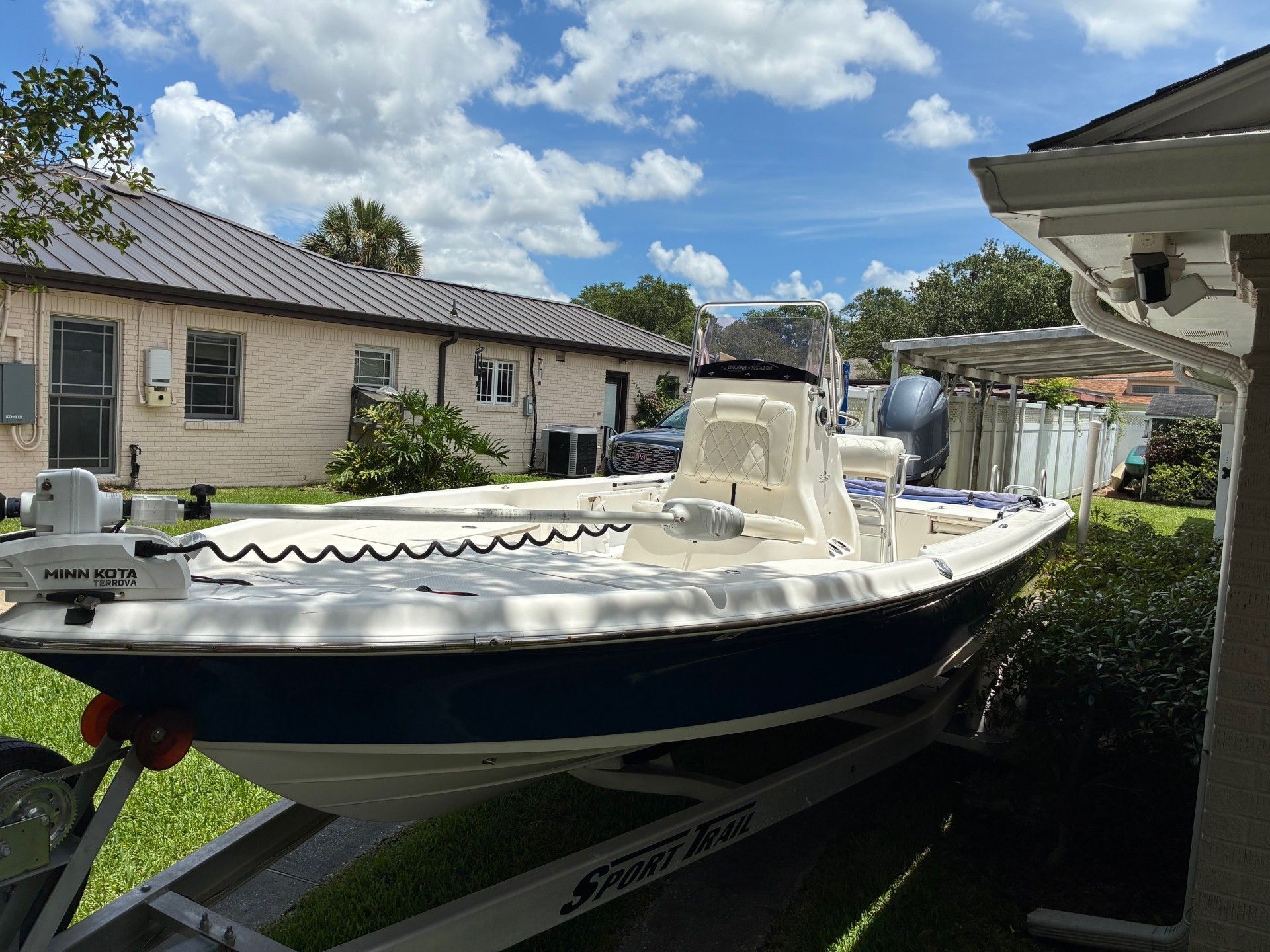 2018 Custom 2200 Pure Bay on a trailer in a backyard.