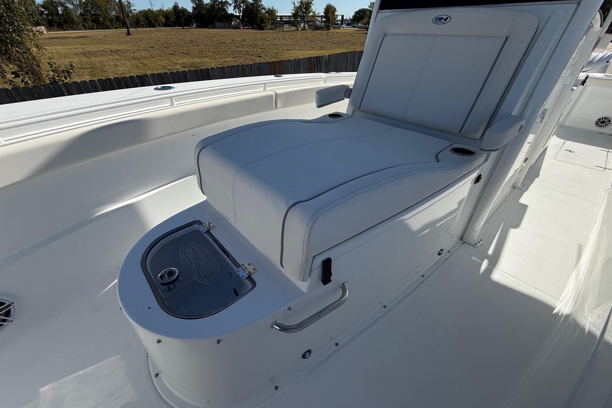 2026 Sea Hunt Gamefish 30 Coffin Box interior with cushioned seating and storage.
