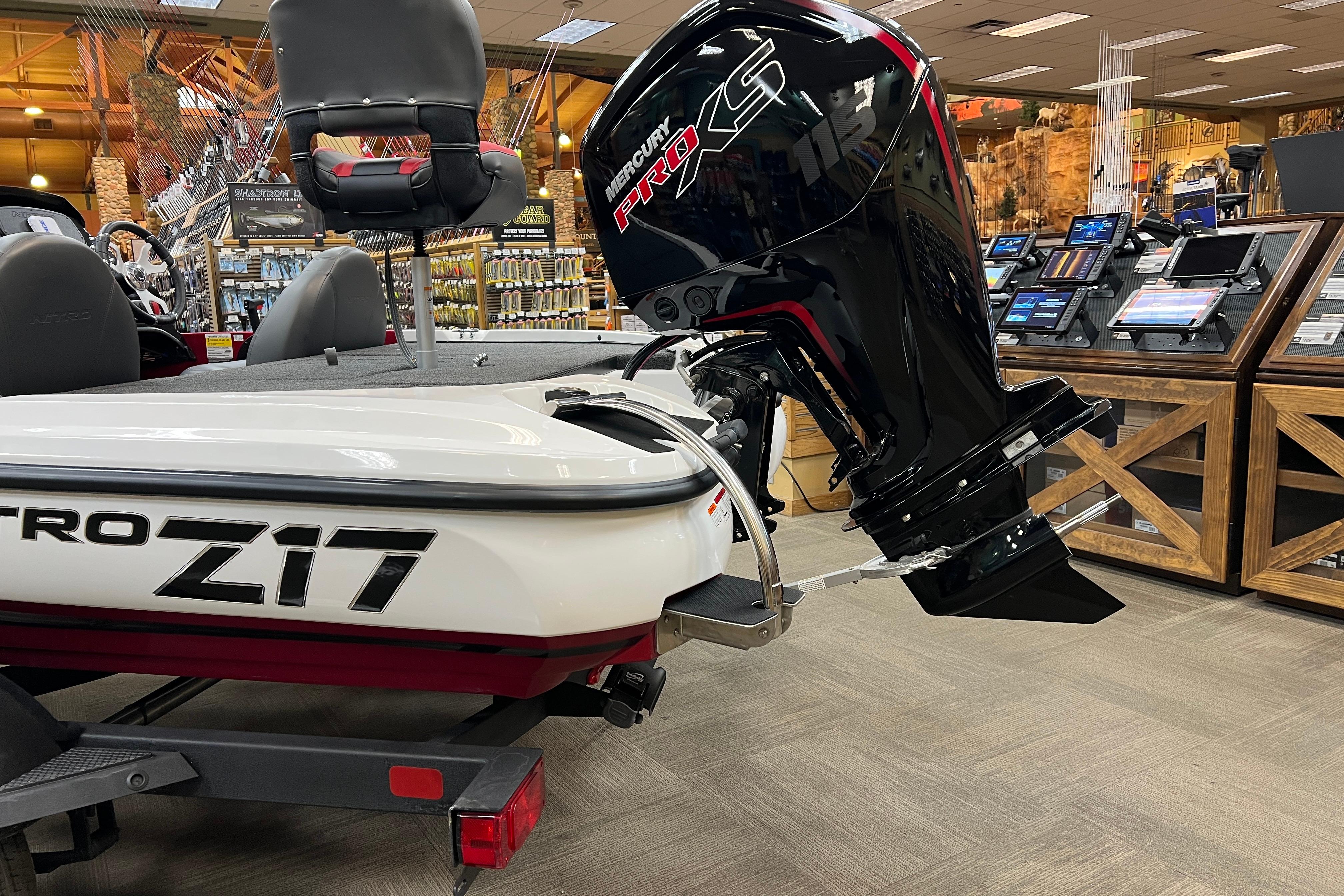 2026 Nitro Z17 boat with Mercury Pro XS engine displayed in a showroom.