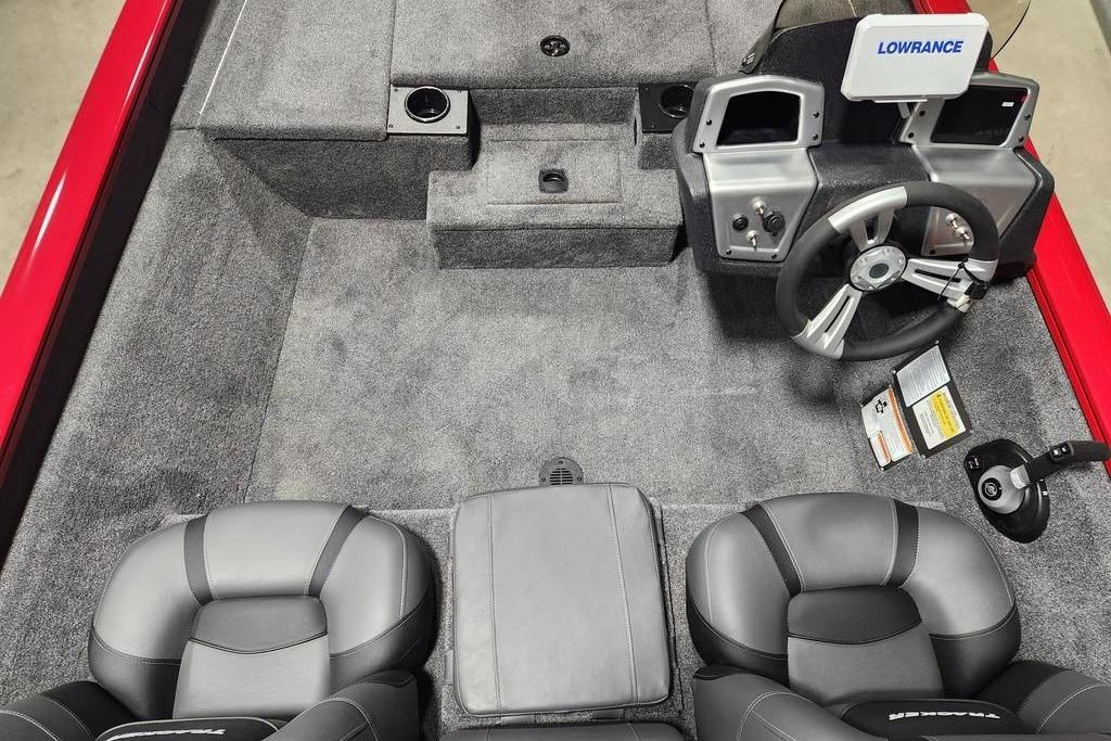 Interior view of 2026 Tracker Pro Team 175 boat with steering wheel and seating.