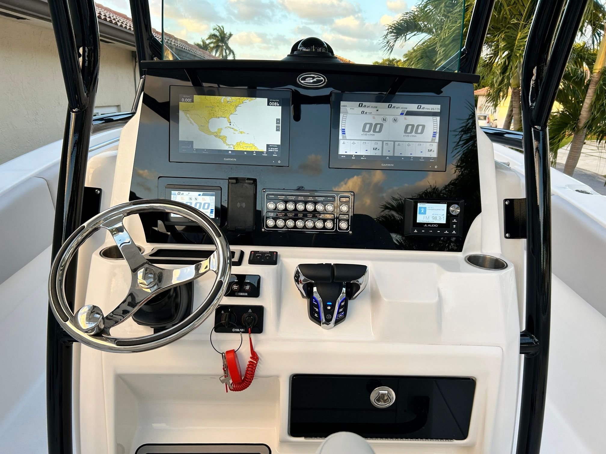 The image shows the helm of a Sea Fox 288 Commander boat with modern navigation systems.