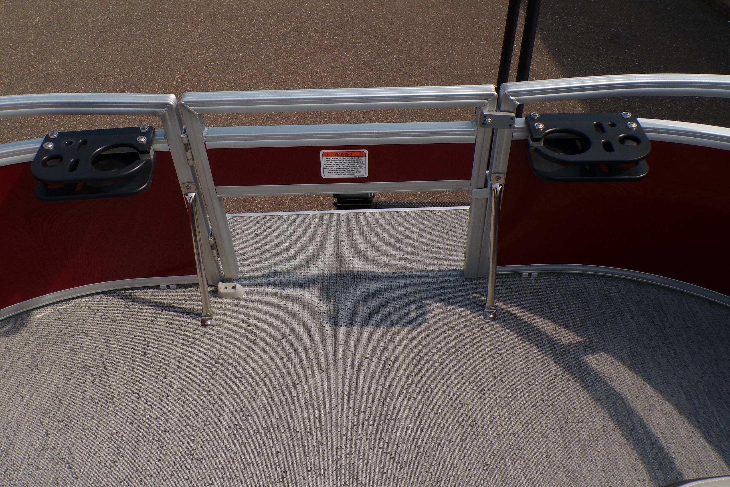 2026 Sun Tracker Bass Buggy 16 XL Select pontoon deck with cup holders and railing.