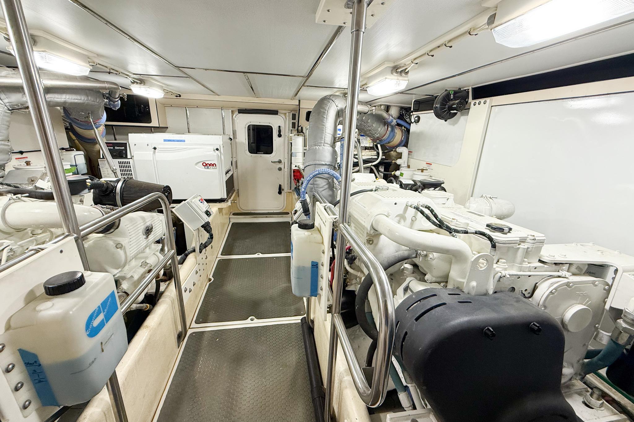 Engine room of 2007 Nordic Tug 54, featuring dual engines and equipment.