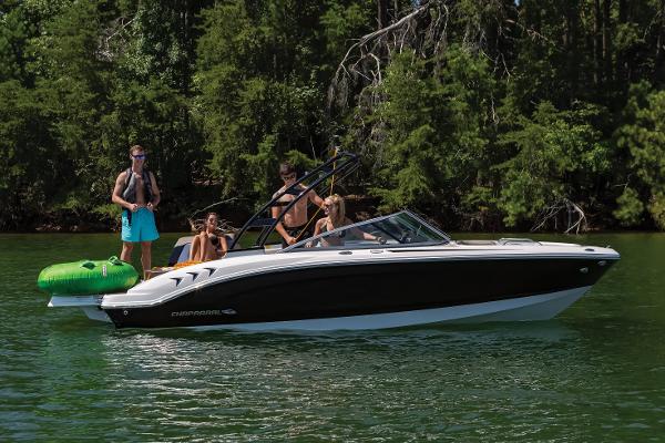 Manufacturer Provided Image: 2025 Chaparral 21 SSi boat on a lake with people enjoying water activities.