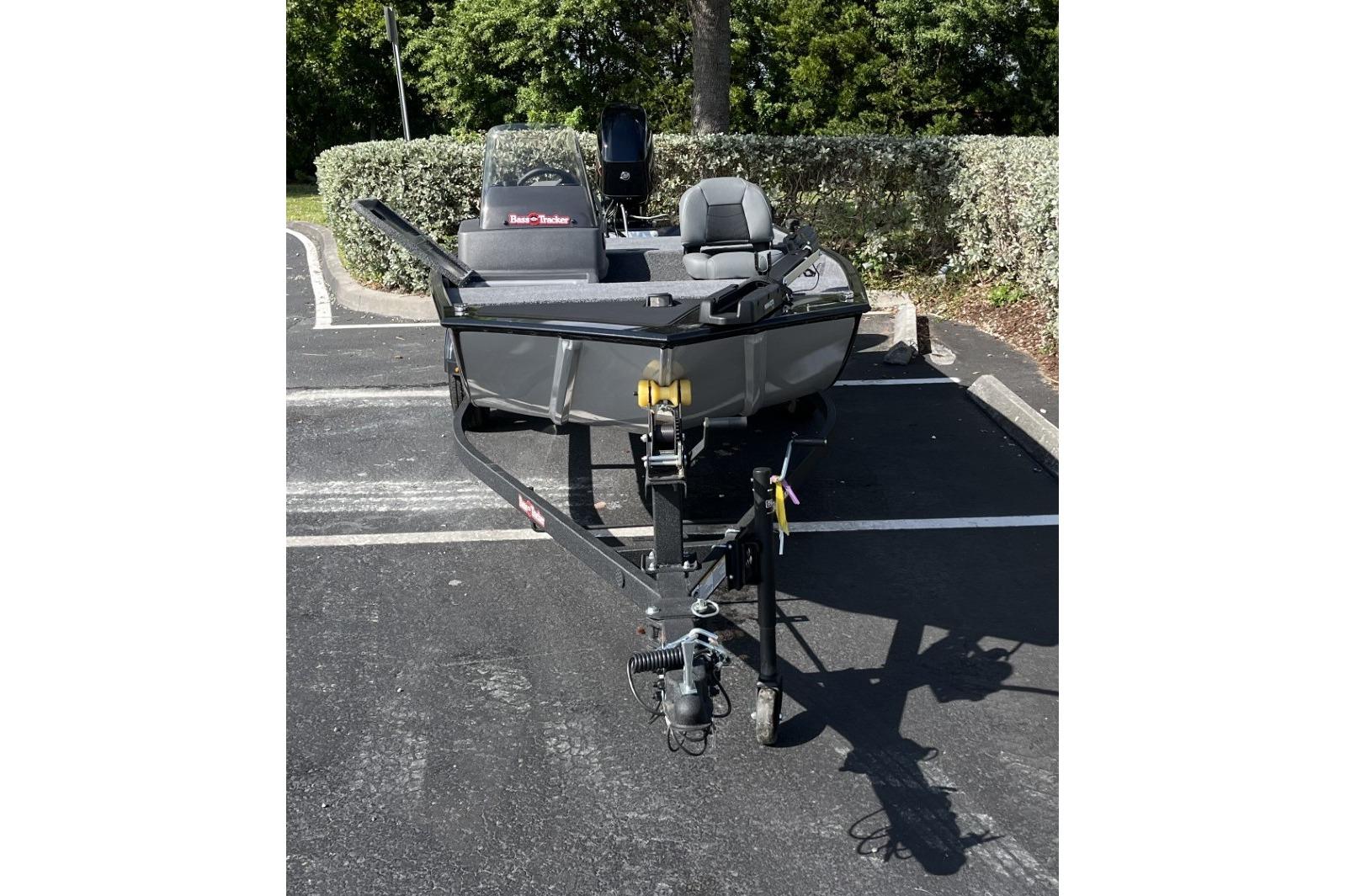 2026 Tracker Bass Tracker Classic XL boat on trailer in parking lot.