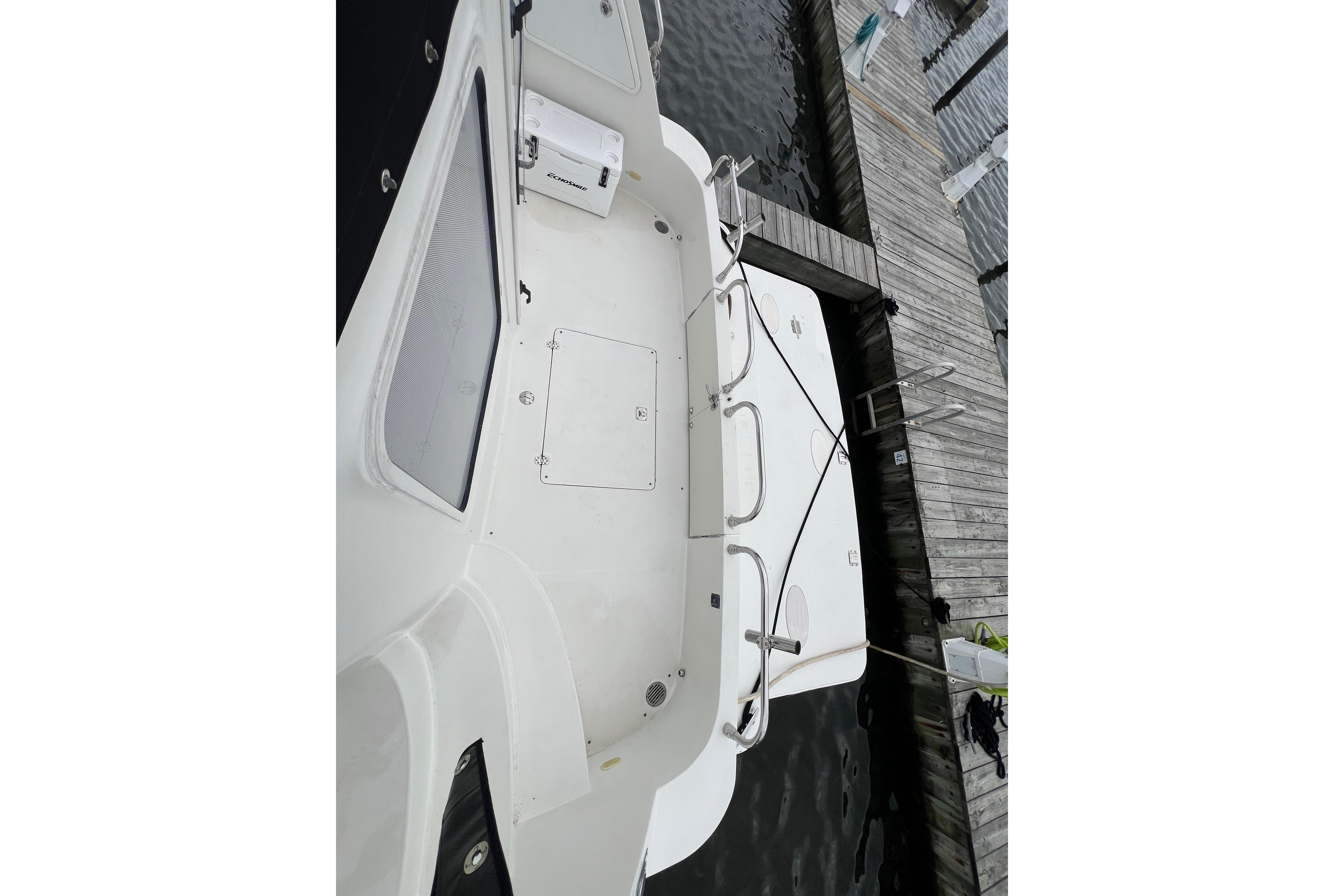 2006 Carver 43 Motor Yacht docked, showcasing spacious deck and sleek design.