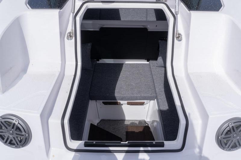 2025 Axopar 29 XC Cross Cabin interior with gray seating and white accents.