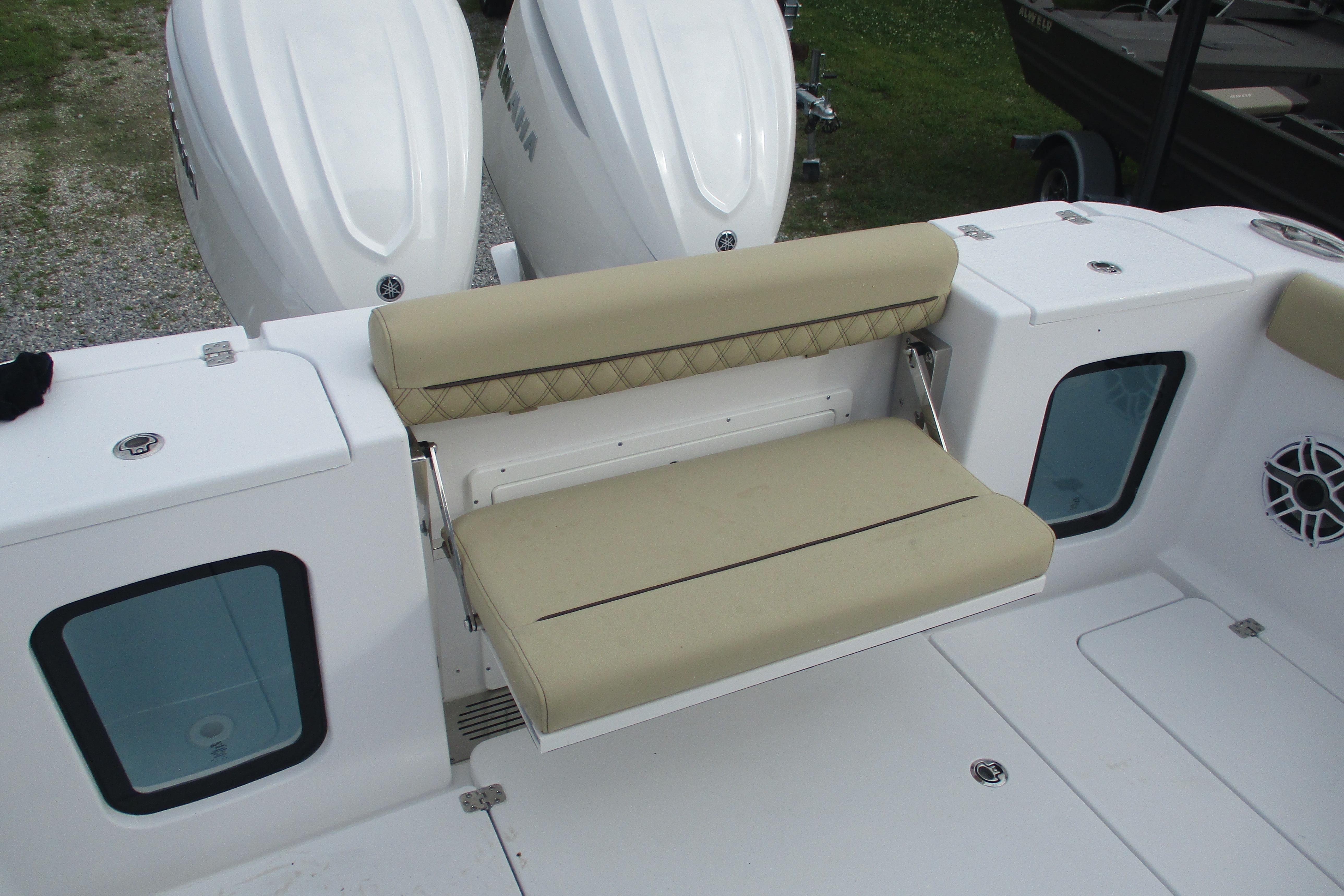 2026 Sportsman Open 302 Center Console boat with beige seating and dual engines.
