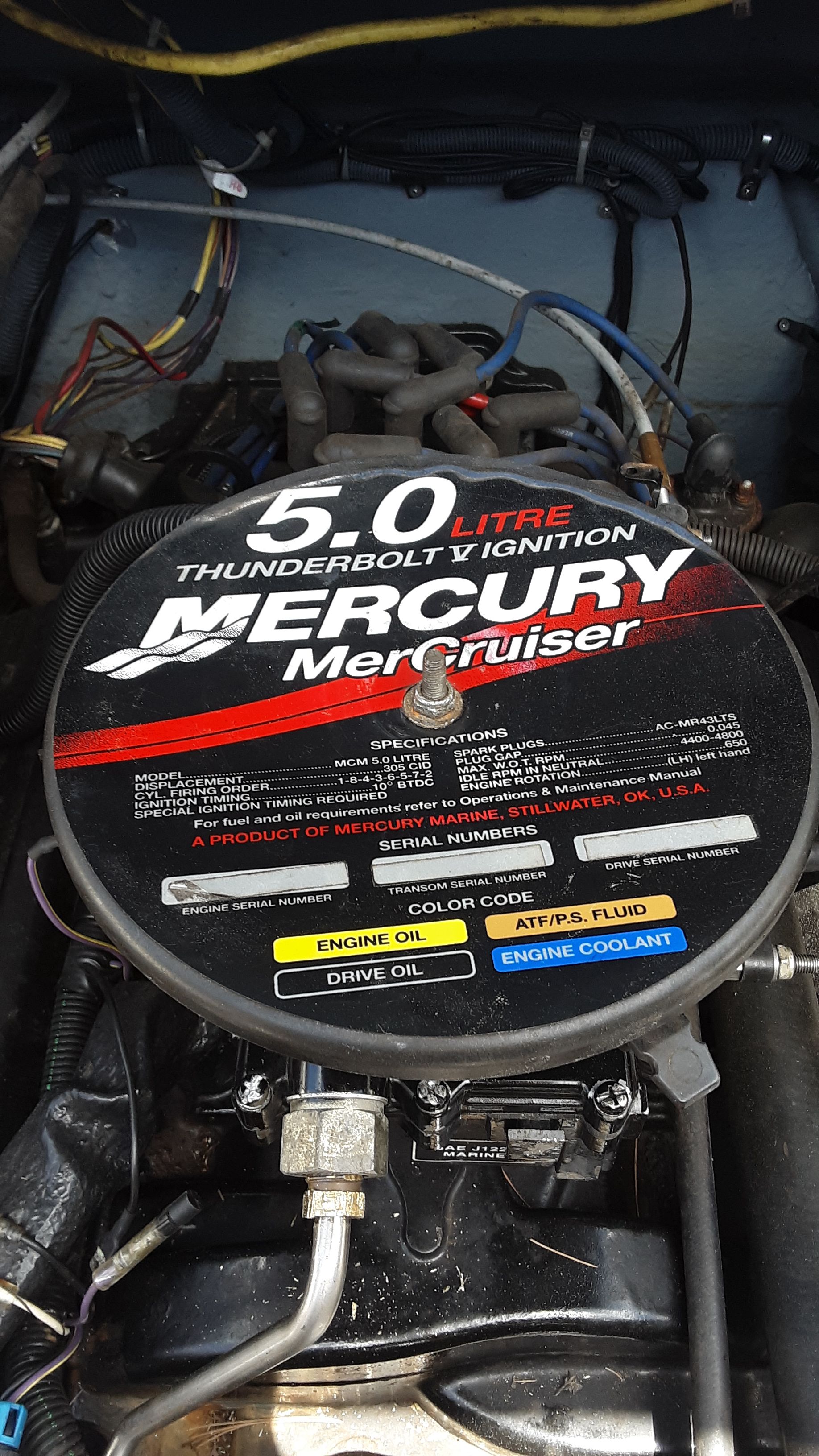 Engine compartment of a 2005 Bayliner 210 Classic with a Mercury Mercruiser engine.