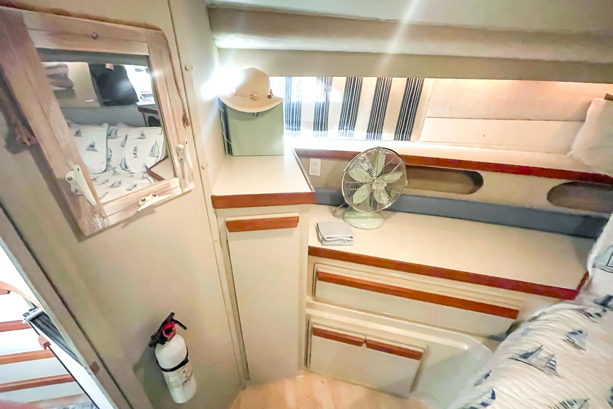 Interior of 1990 Carver 32 Montego boat with cozy cabin and nautical decor.