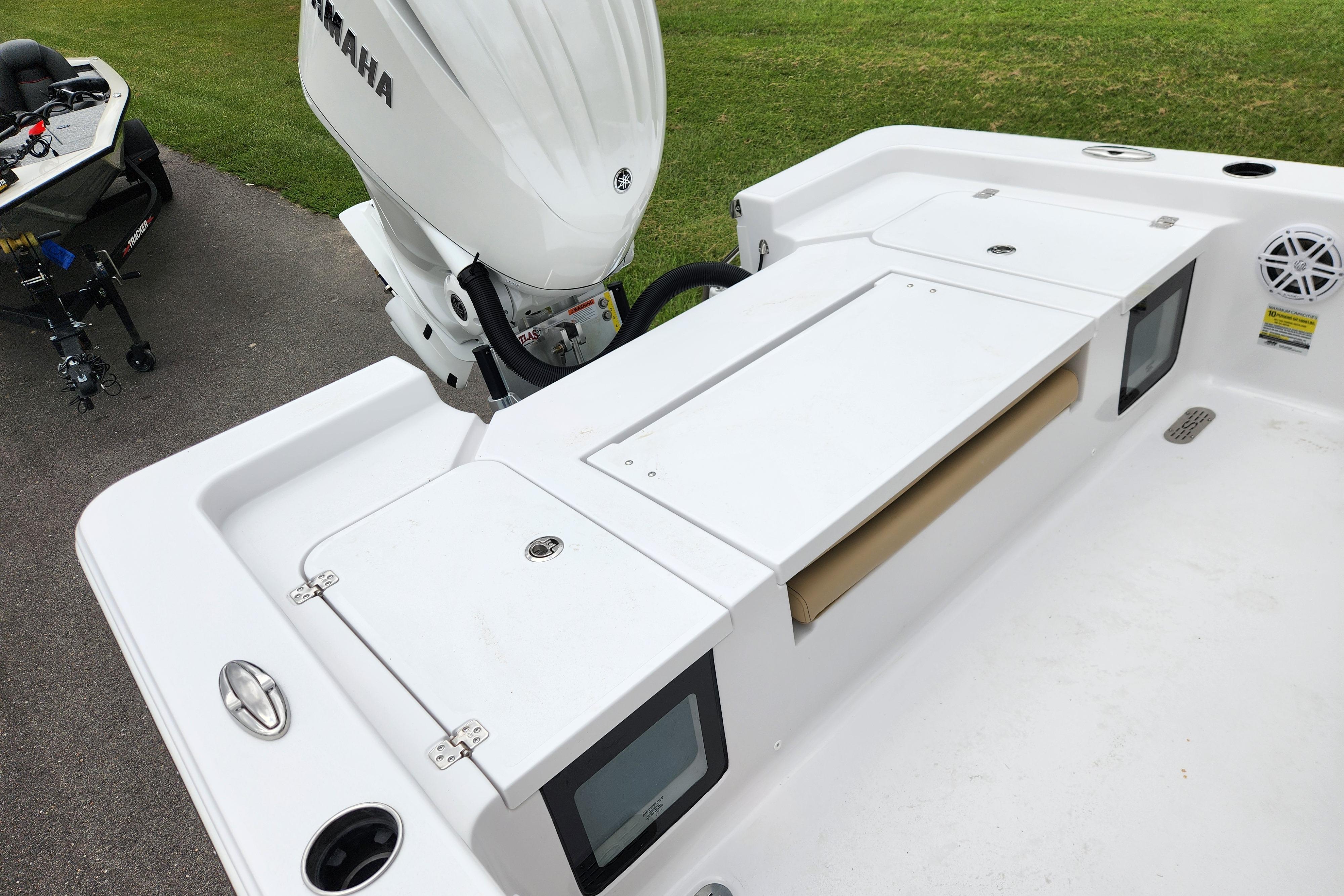 2026 Sportsman Masters 247 Bay Boat with Yamaha engine, featuring spacious deck and storage compartments.