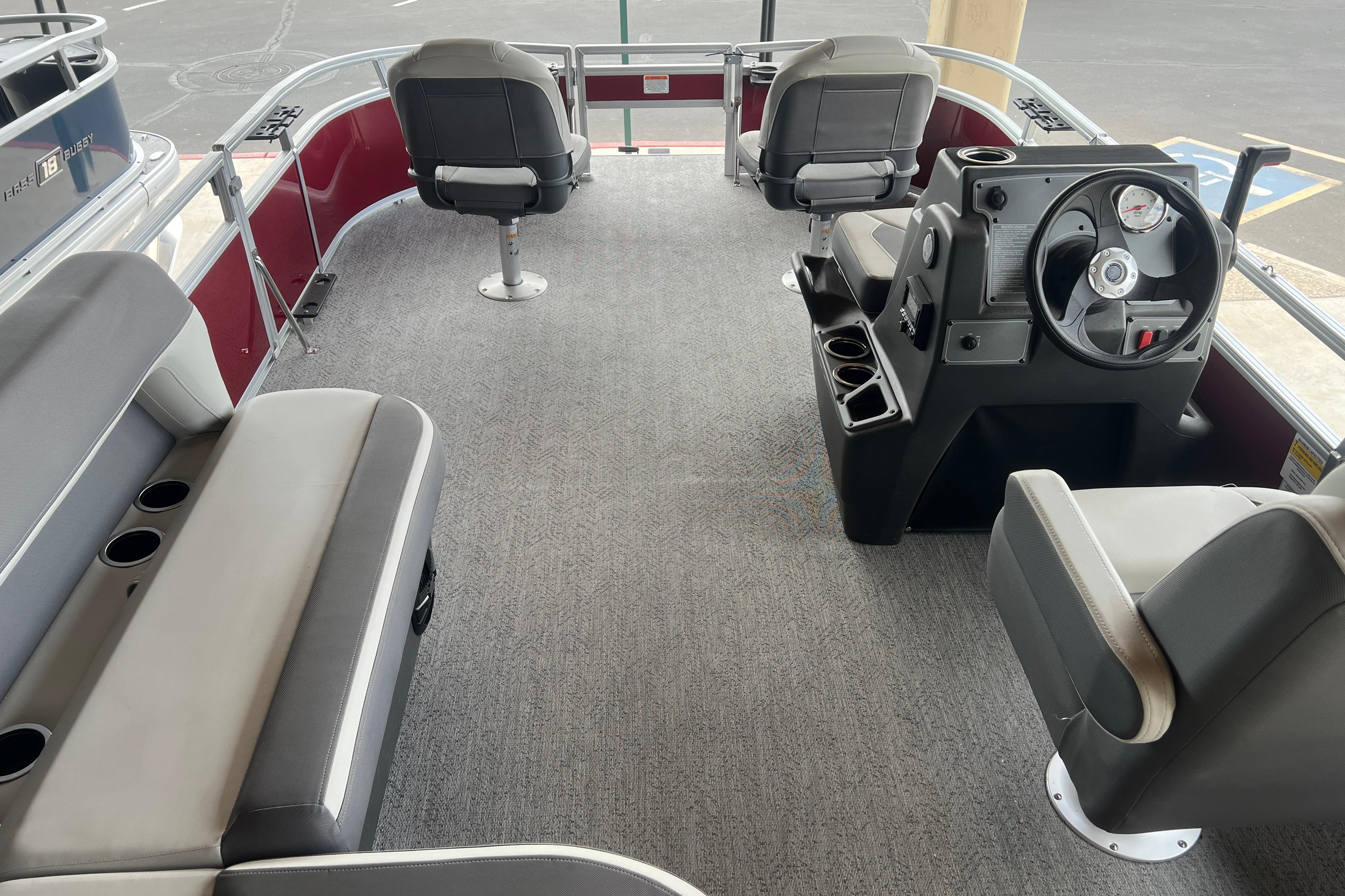 2026 Sun Tracker Bass Buggy 16 XL Select interior with seating and steering console.