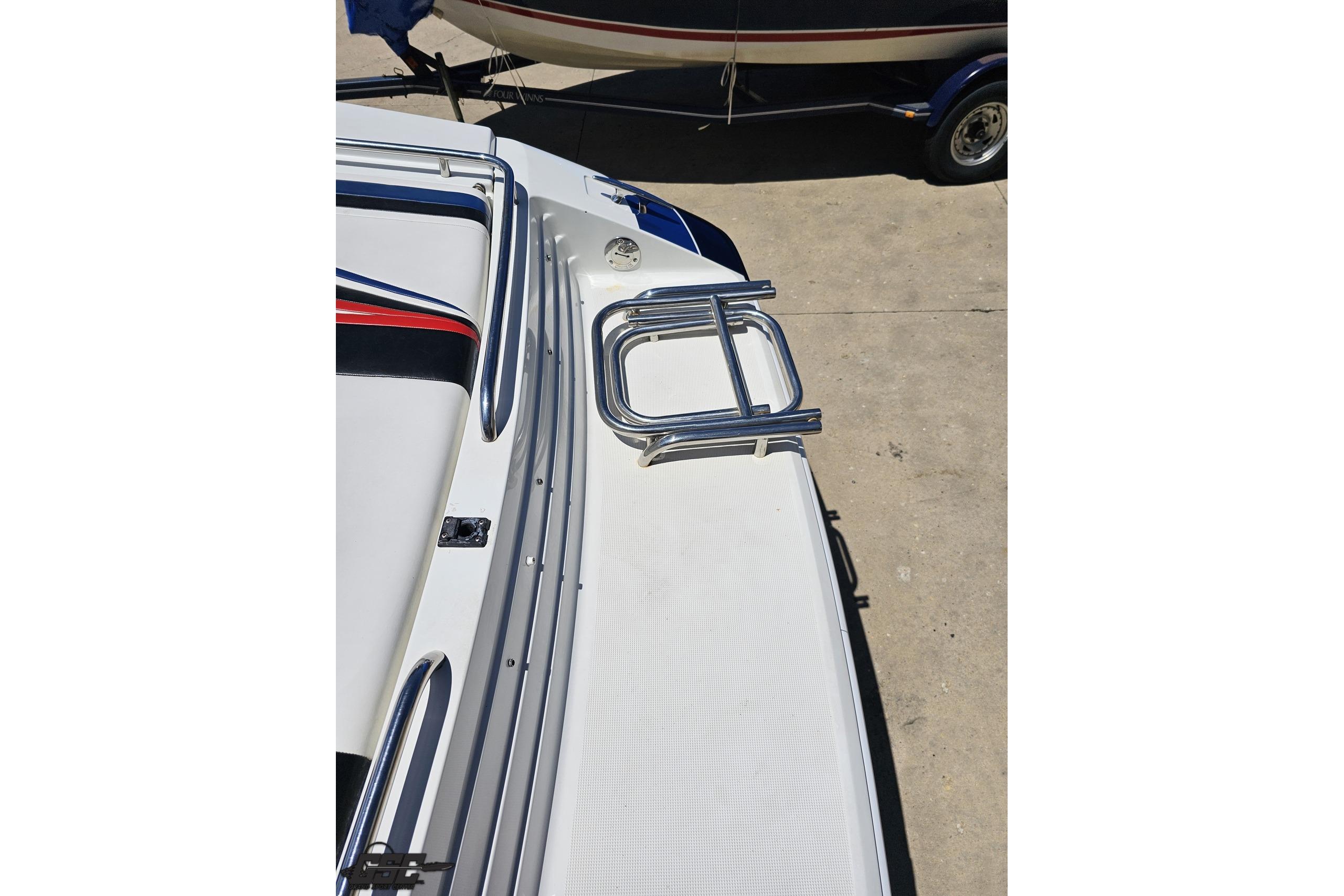 2005 Formula 271 FASTech boat deck with chrome railing and sleek design.