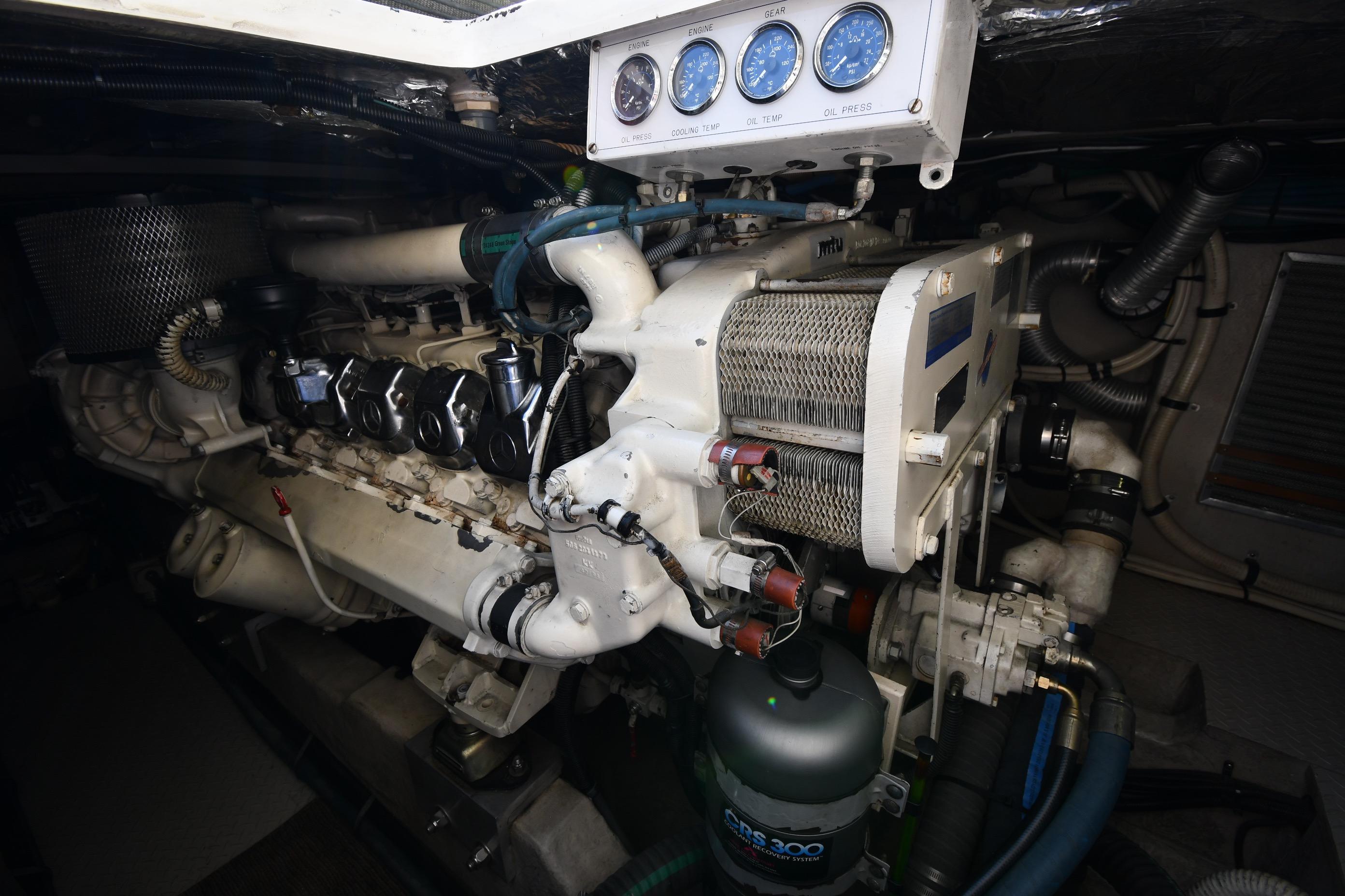 Engine room of a 1995 Sea Ray 630 Sundancer with visible gauges and components.
