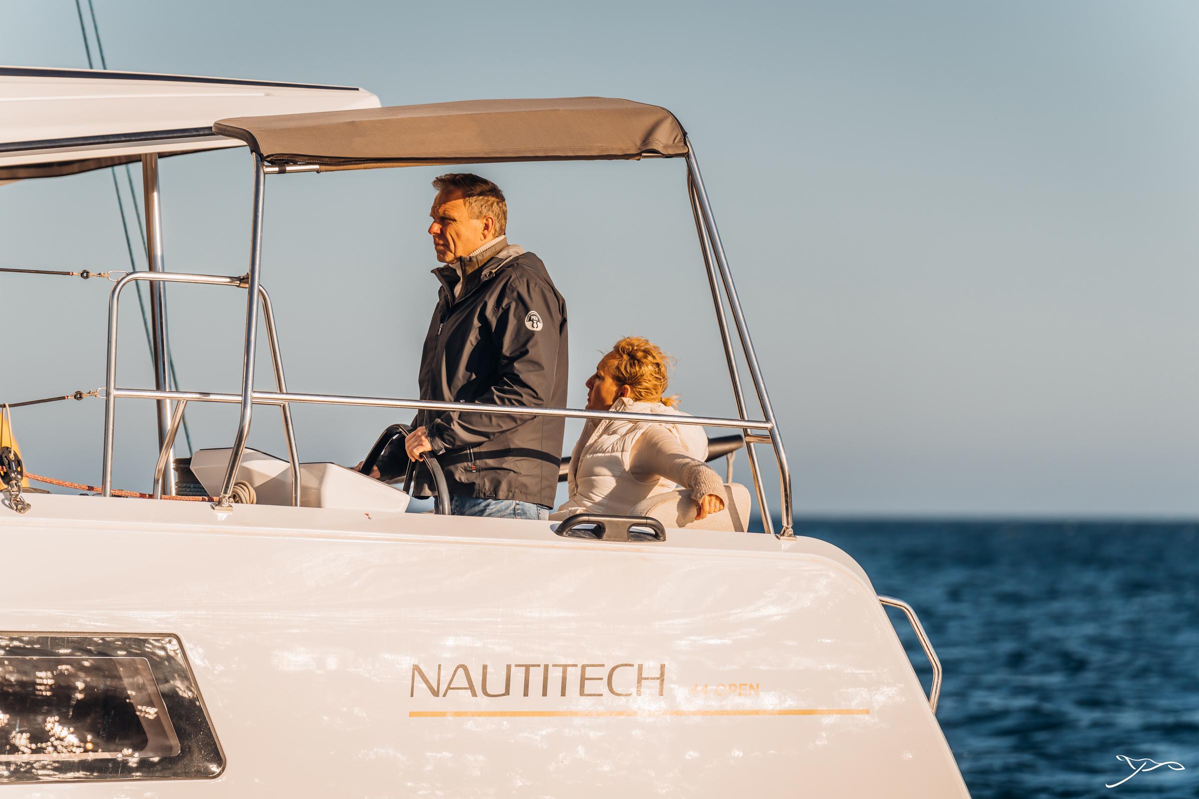 Couple enjoying a cruise on a 2025 Nautitech 44 Open catamaran.