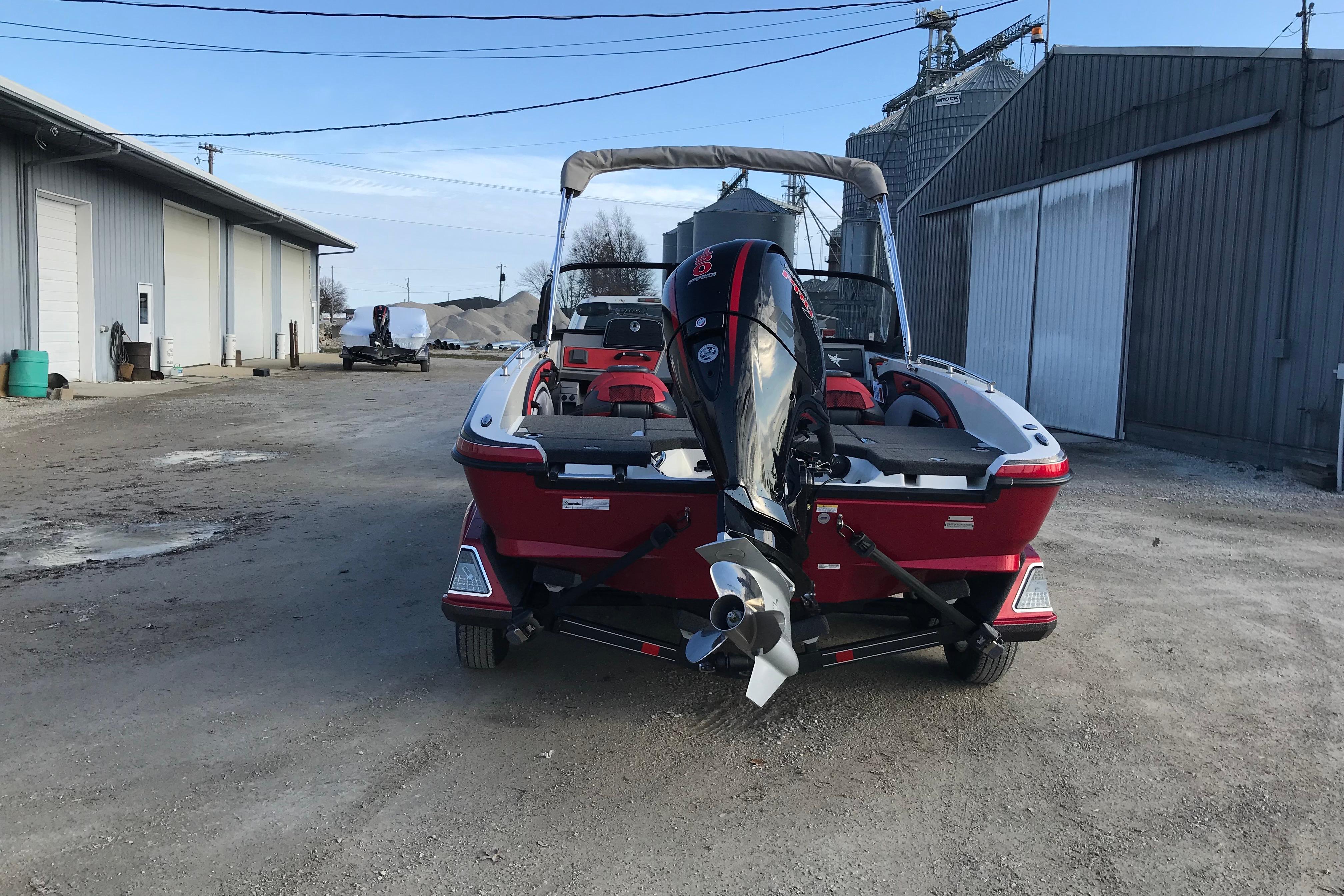 2026 Ranger 1850MS boat with outboard motor parked outdoors.