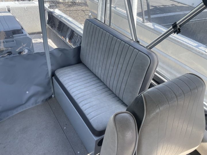 Interior of a 2004 Design Concepts 22' Open Bow Jet with gray seating.