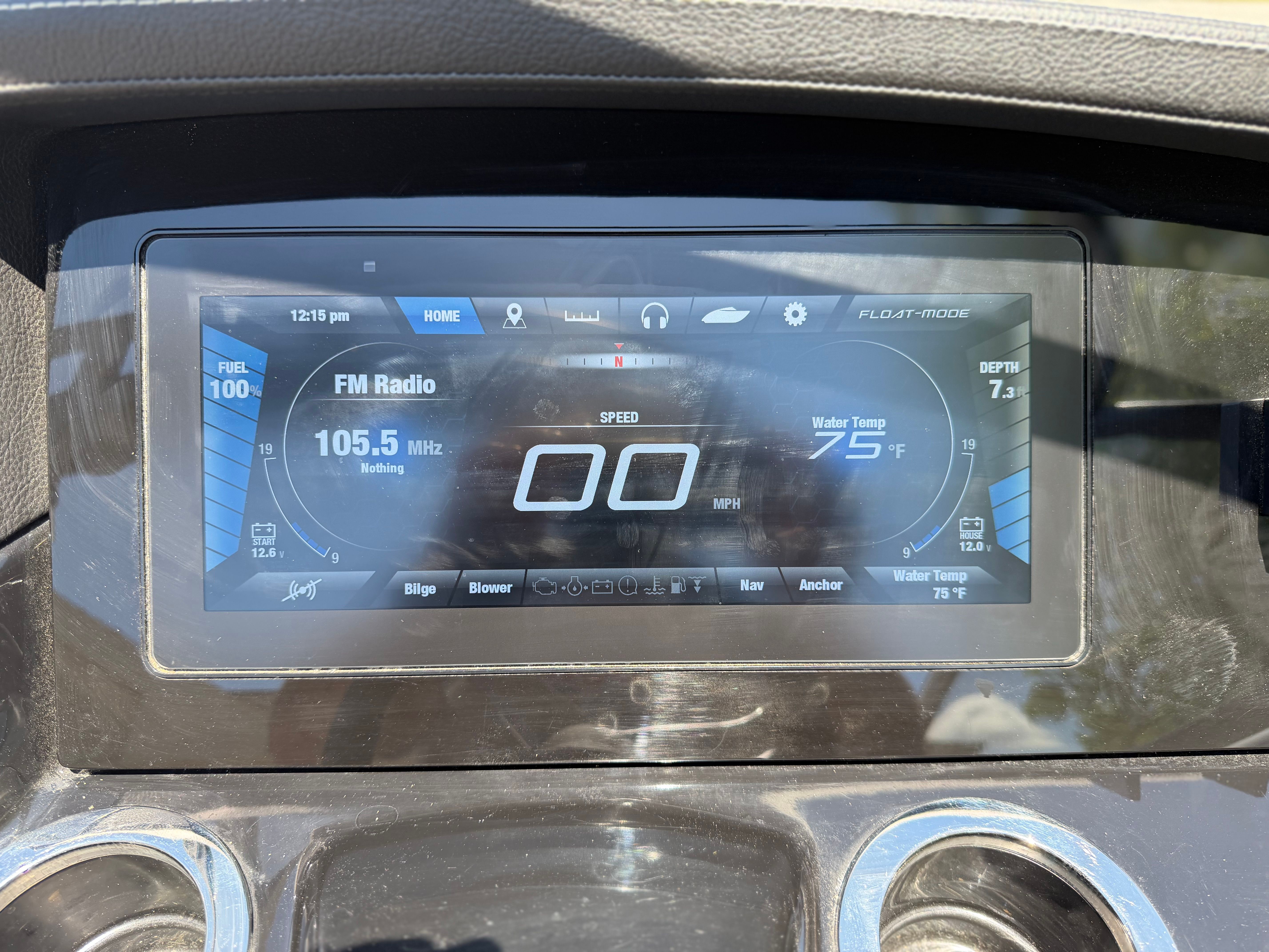 The image shows the dashboard of a Yamaha 242 Limited S boat with a digital display.