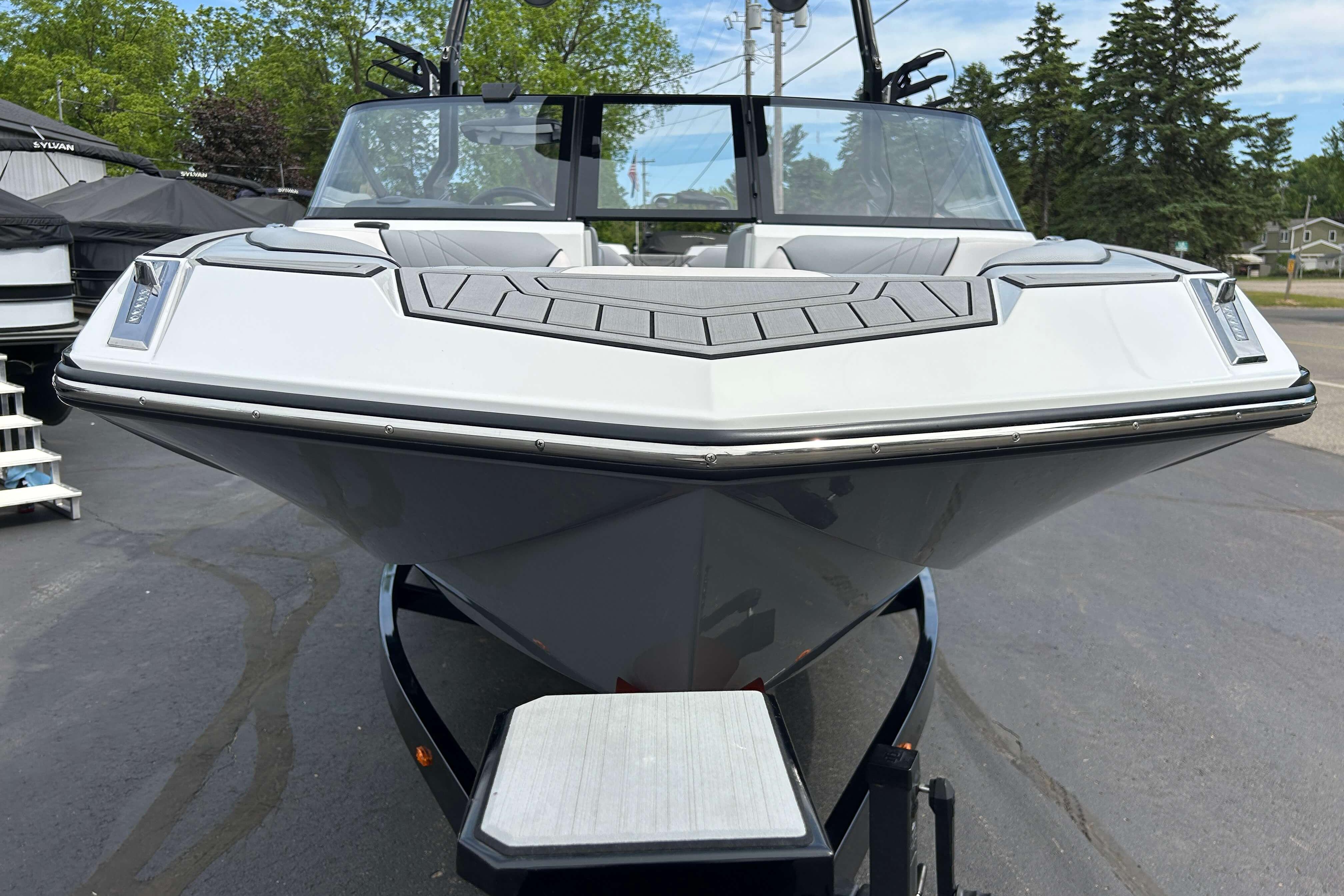 2021 Nautique Super Air Nautique GS24 boat on trailer, front view.