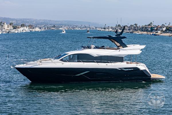 2025 Sunseeker Manhattan 68 yacht cruising on a scenic waterway.