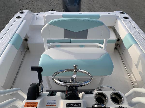 2024 Robalo R202 Explorer boat interior with white and teal seating.