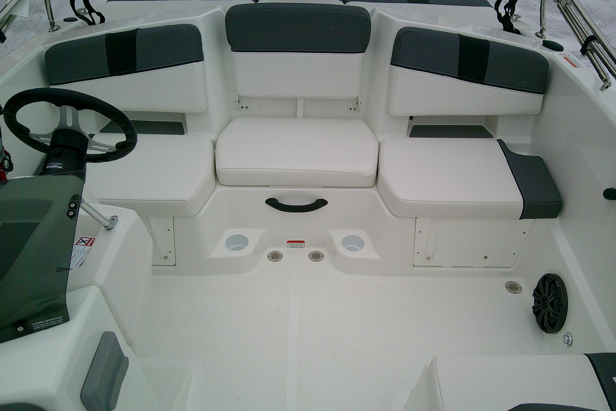 2026 Tahoe T18 boat interior with white seating and steering wheel.