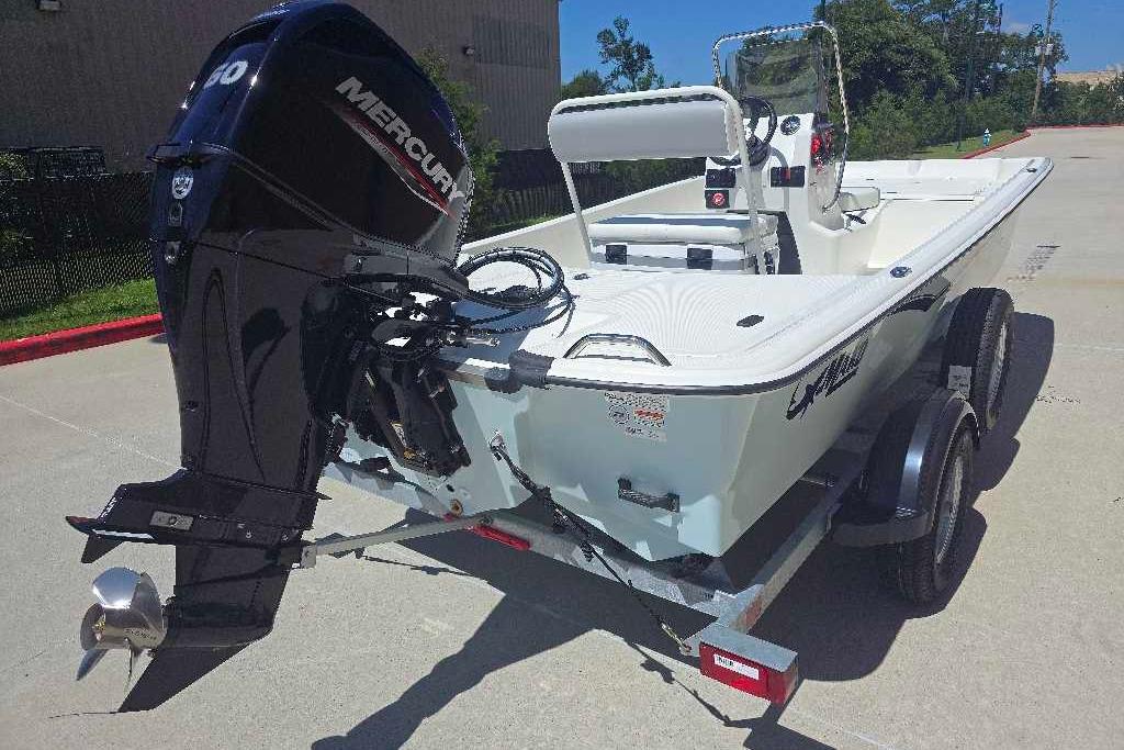 2026 Mako Pro Skiff 17 CC boat on trailer with Mercury outboard motor.