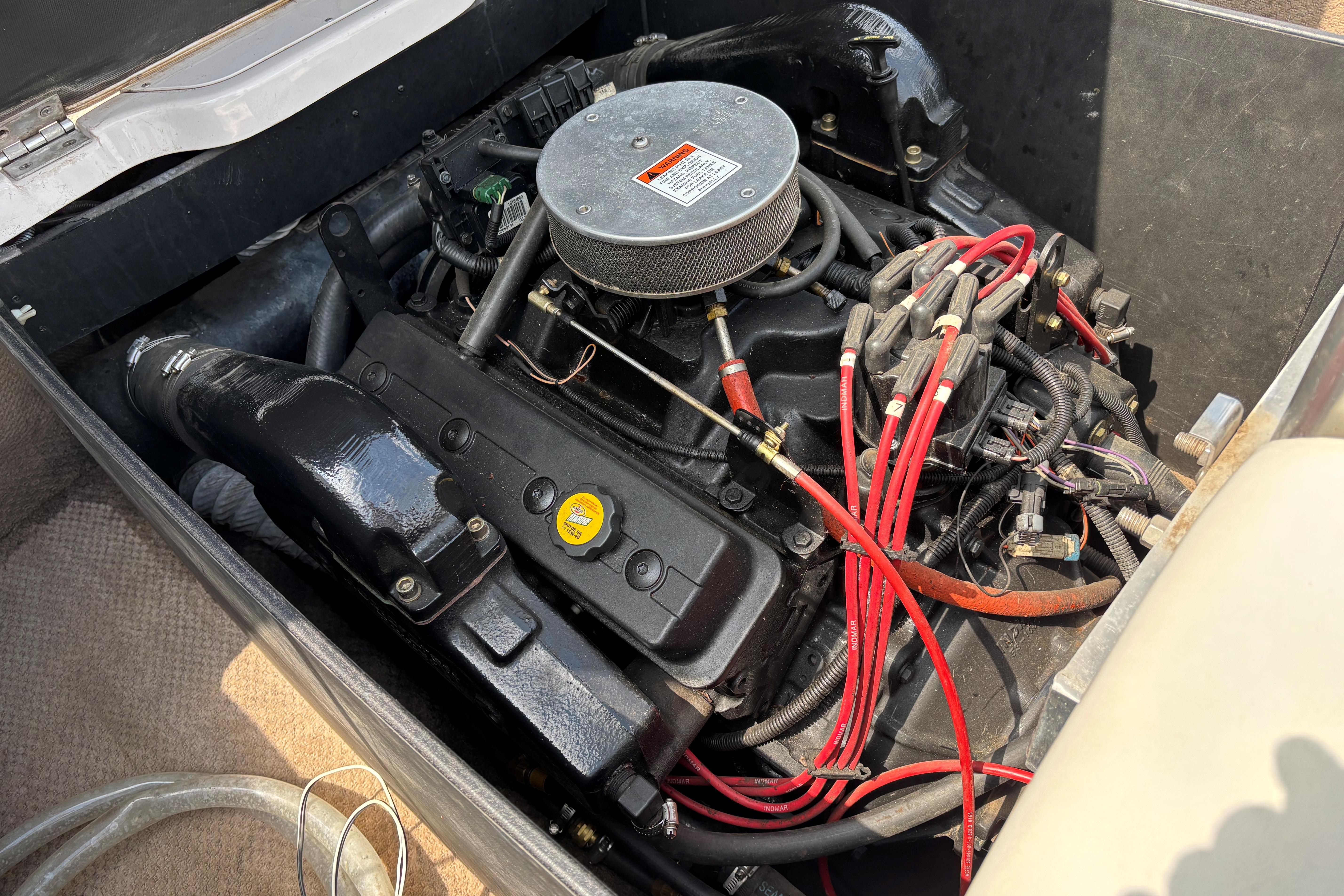 1999 MasterCraft 205 PRO STAR engine compartment with visible wiring and components.