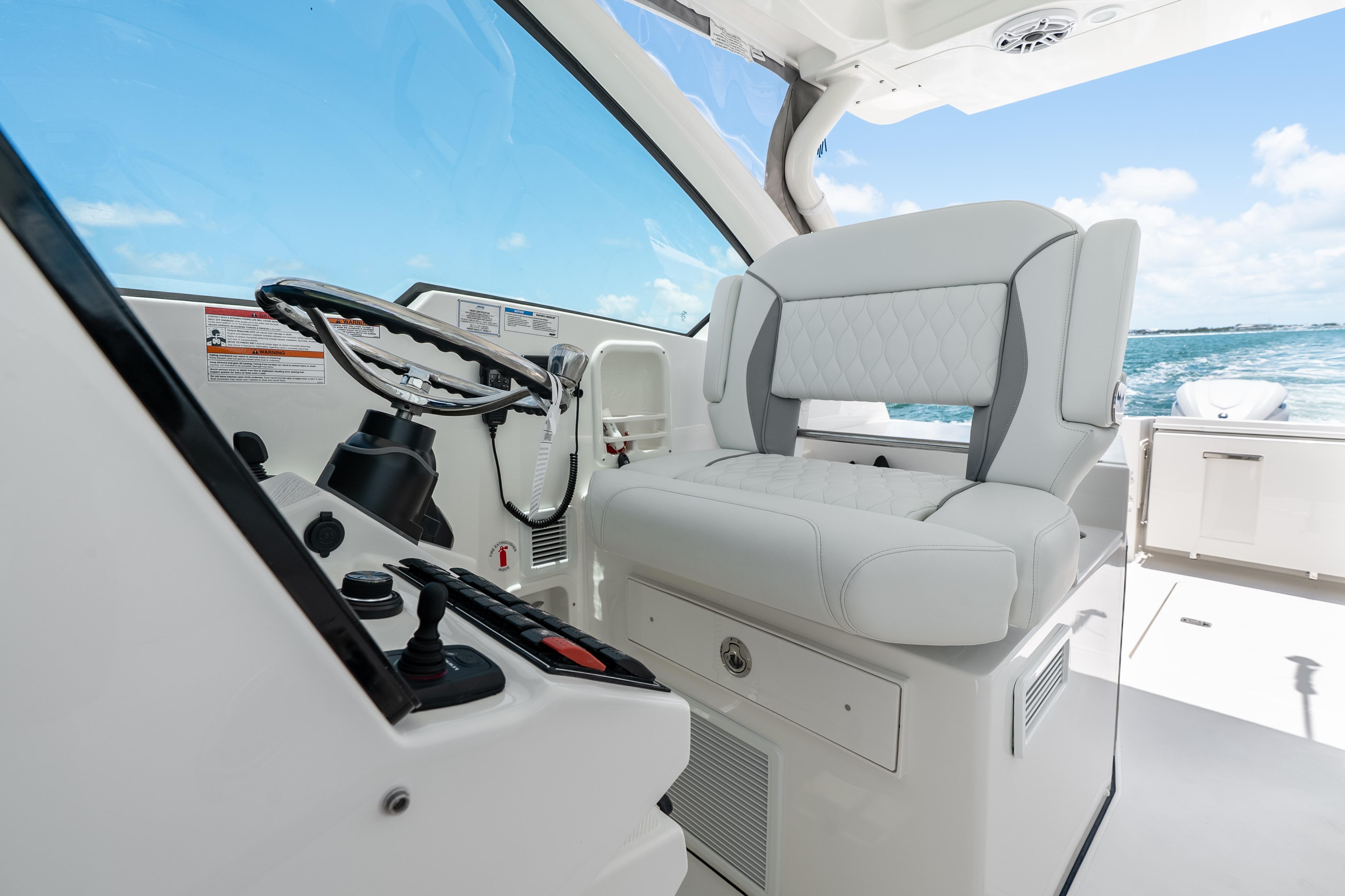 2026 Pursuit DC 326 Dual Console helm with luxurious seating and ocean view.