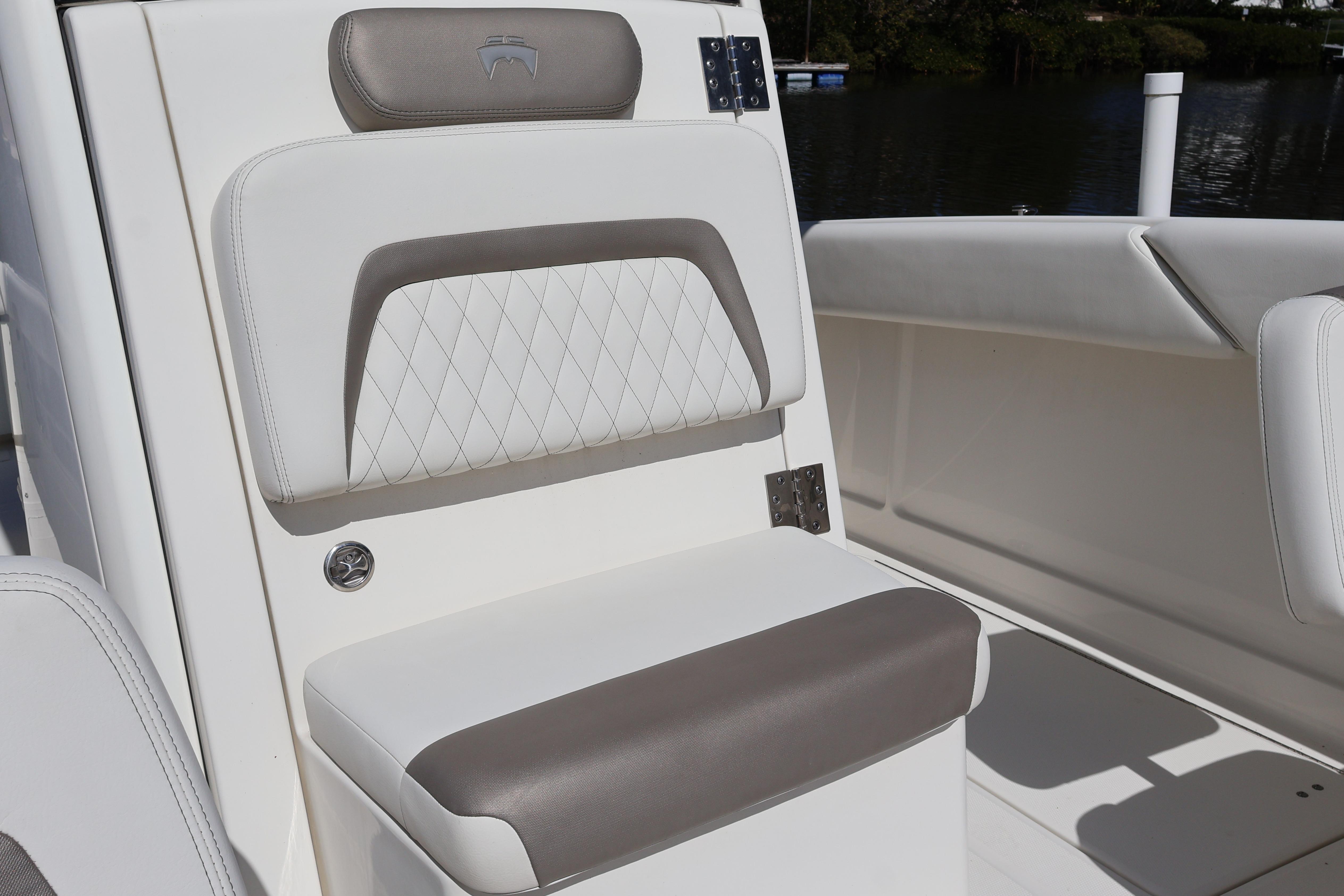 Luxurious seating on 2022 World Cat 280 CC-X boat, featuring elegant upholstery design.