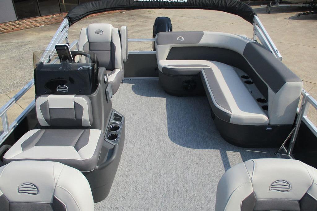 2026 Sun Tracker Bass Buggy 16 XL Select pontoon boat interior with gray seating and helm.